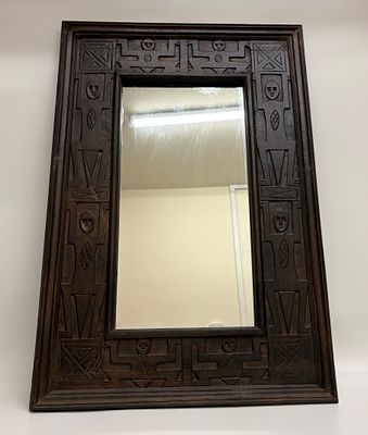 Carved Wooden Wall Mirror with Folk Art Figural Motifs 63 x 93 Cm. A rectangular wall mirror 