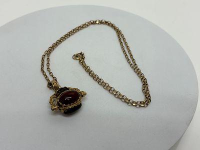 9ct Gold Double-Sided Swivel Fob Pendant on Chain 14.07G gross. A 9ct yellow gold double-sided 