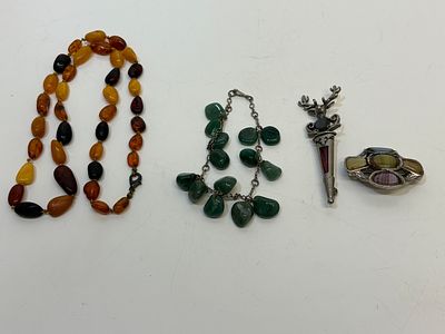 A Collection of Vintage Costume Jewellery including an Amber Necklace and Scottish Style Brooches. 