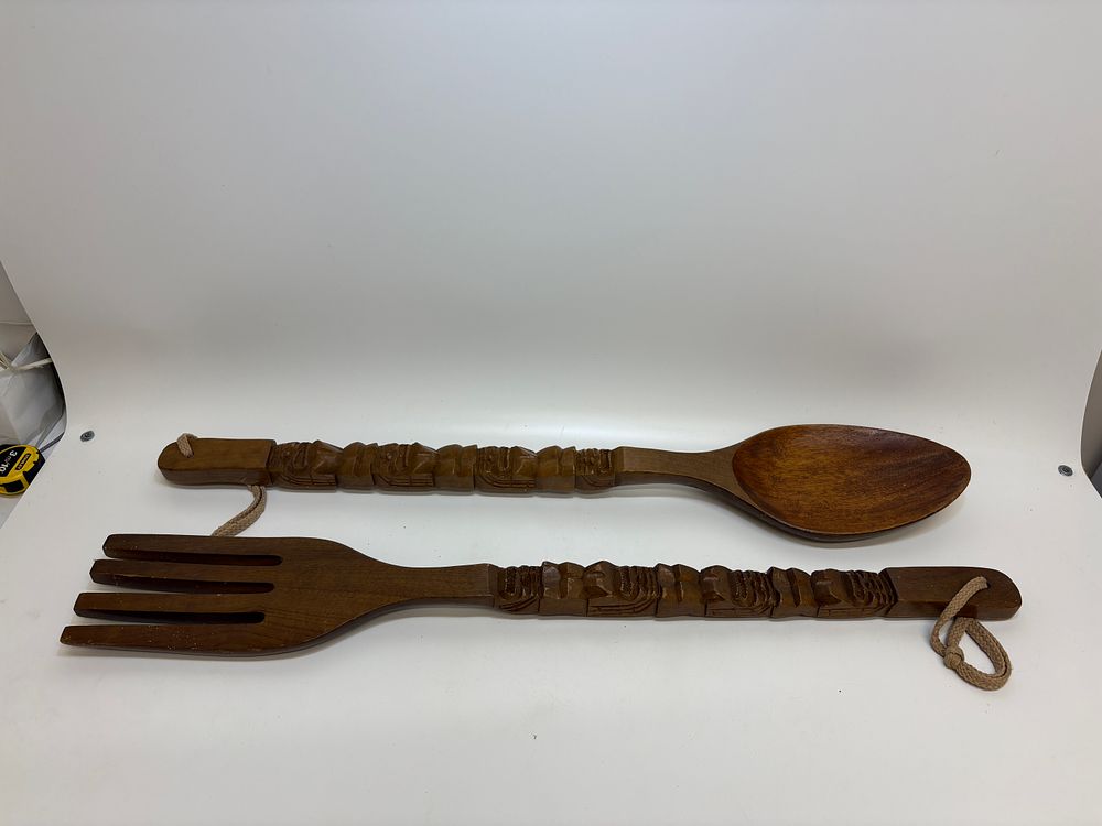 Lot 590: A Pair of Large Hand-Carved Wooden Spoon and Fork Wall Hangings with Anthropomorphic Handles
