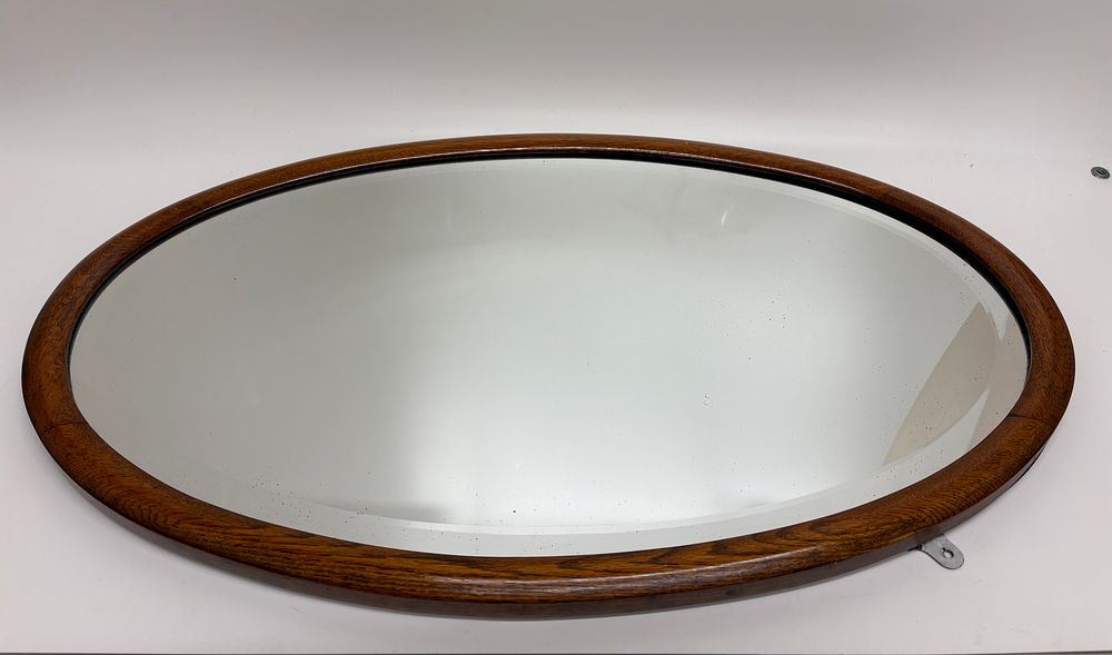 Lot 593: Antique Edwardian Bevelled Oval Oak Wall Mirror