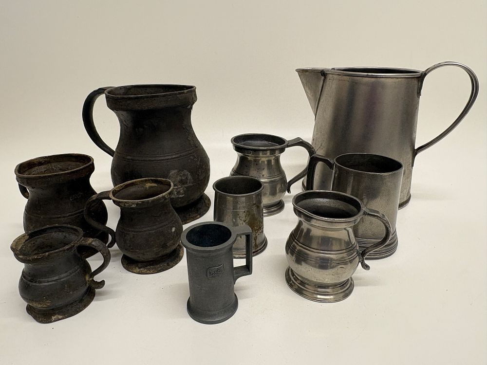 Lot 351: A Collection of English Pewter Drinking Vessels and Graduated Measures including Harrison Sheffield & Co