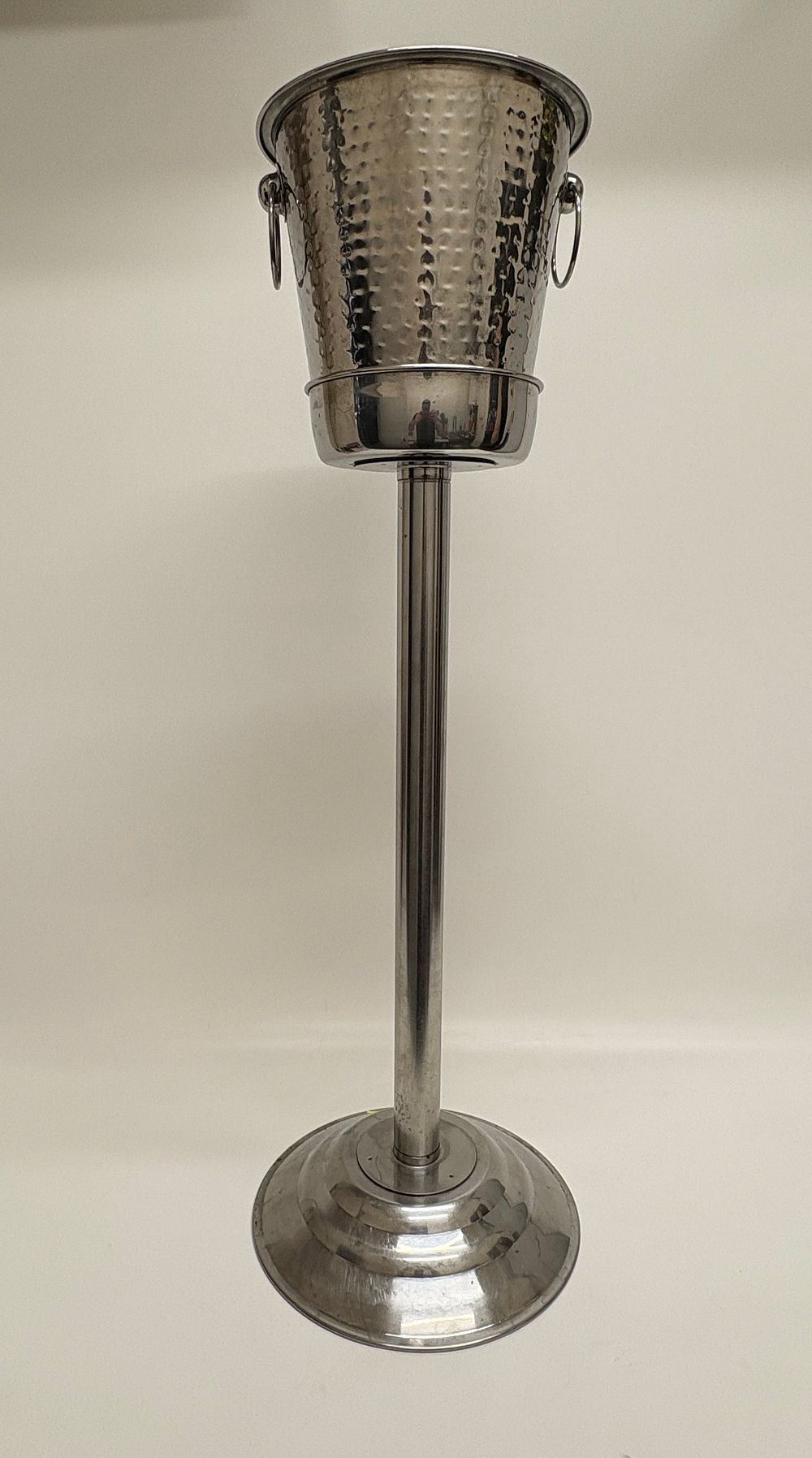 Lot 466: A Hammered Stainless Steel Wine Cooler Bucket and Floor Stand