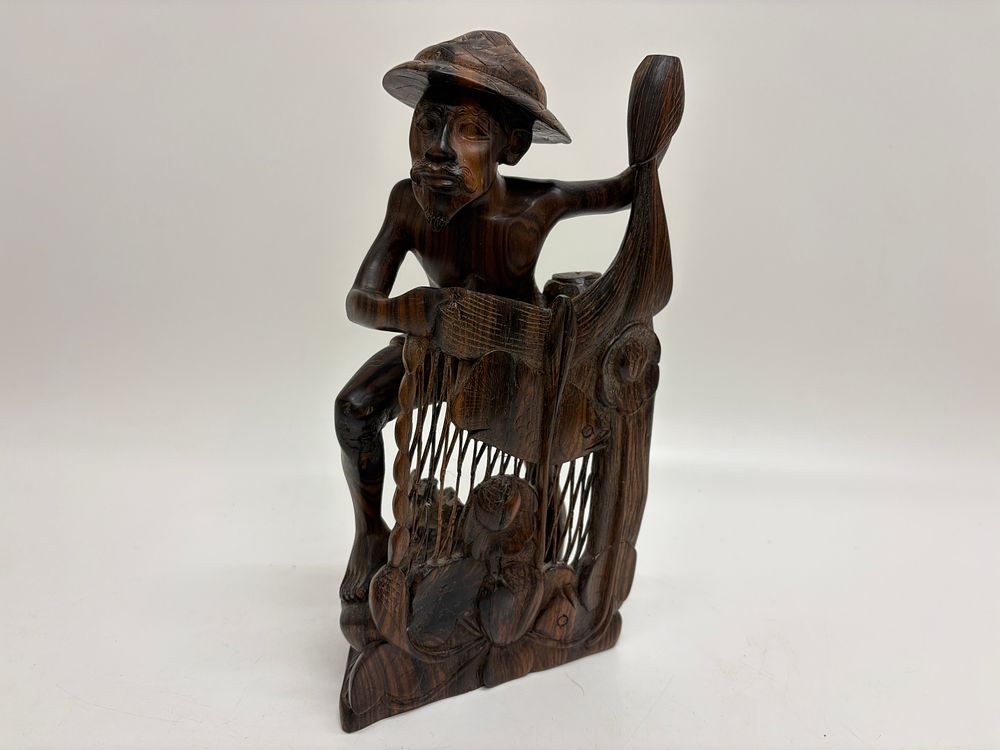 Lot 525: Balinese Hand Carved Ebony Wood Figure of a Fisherman