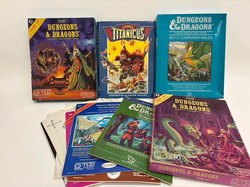 Lot 556: A Collection of Vintage Dungeons & Dragons Role-Playing Game Boxed Sets and Adventure Modules with Codex Titanicus
