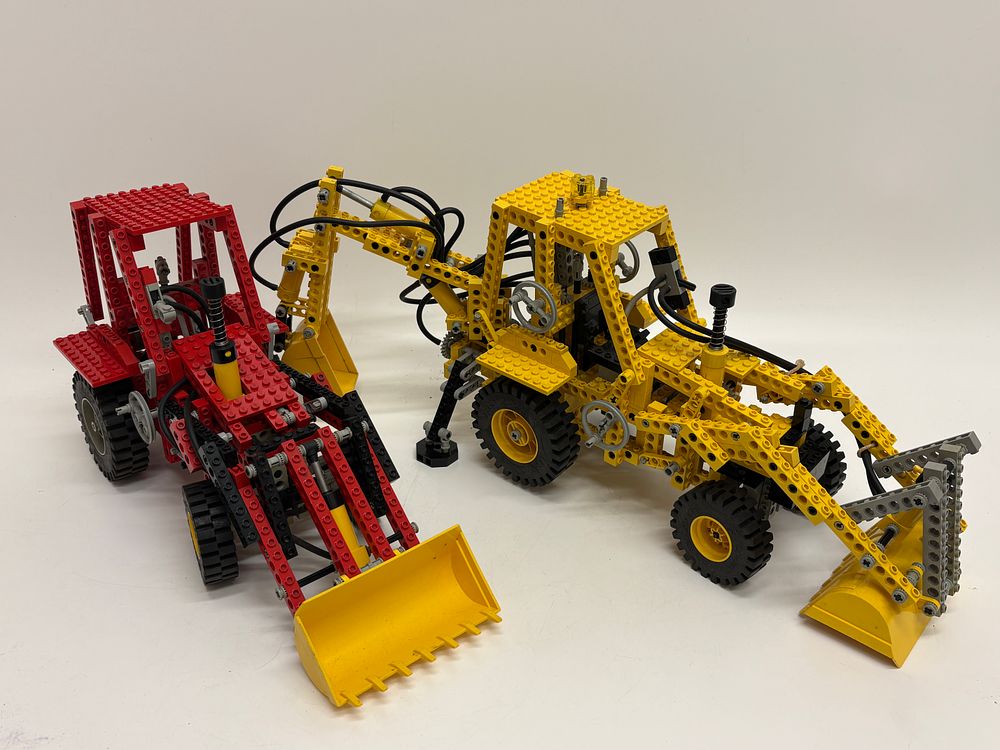 Lot 560: A Collection of Vintage LEGO Technic Construction Vehicles including Sets 8862 and 8853 with Minifigures and Loose Parts
