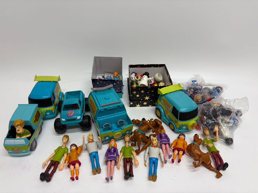 Lot 562: A Collection of Scooby-Doo Character Options Action Figures and Vehicles with an Assortment of Playmobil Figures and Accessories