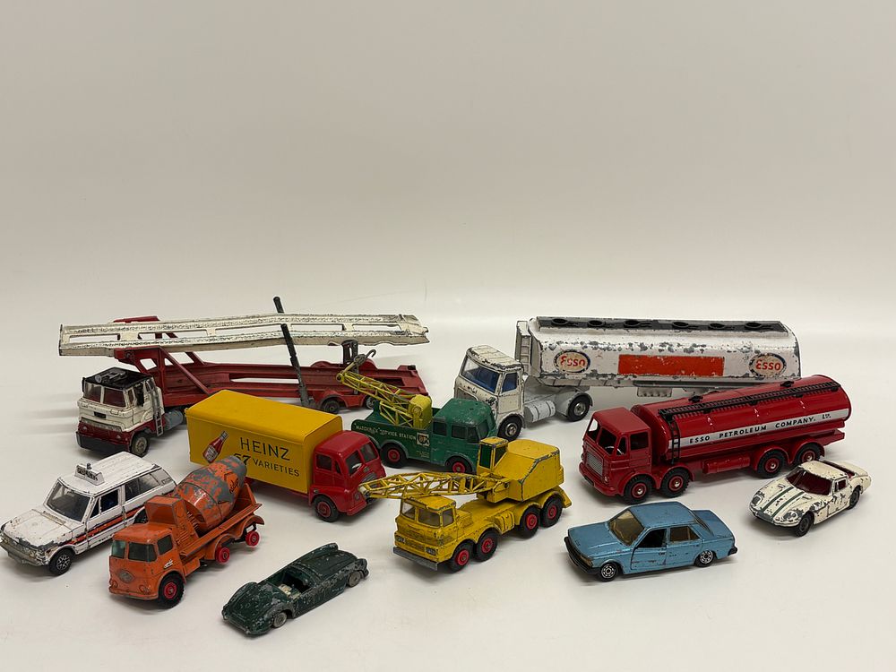 Lot 570: A Collection of Eleven Vintage and Reproduction Die-Cast Toy Vehicles Including Dinky Toys and Matchbox