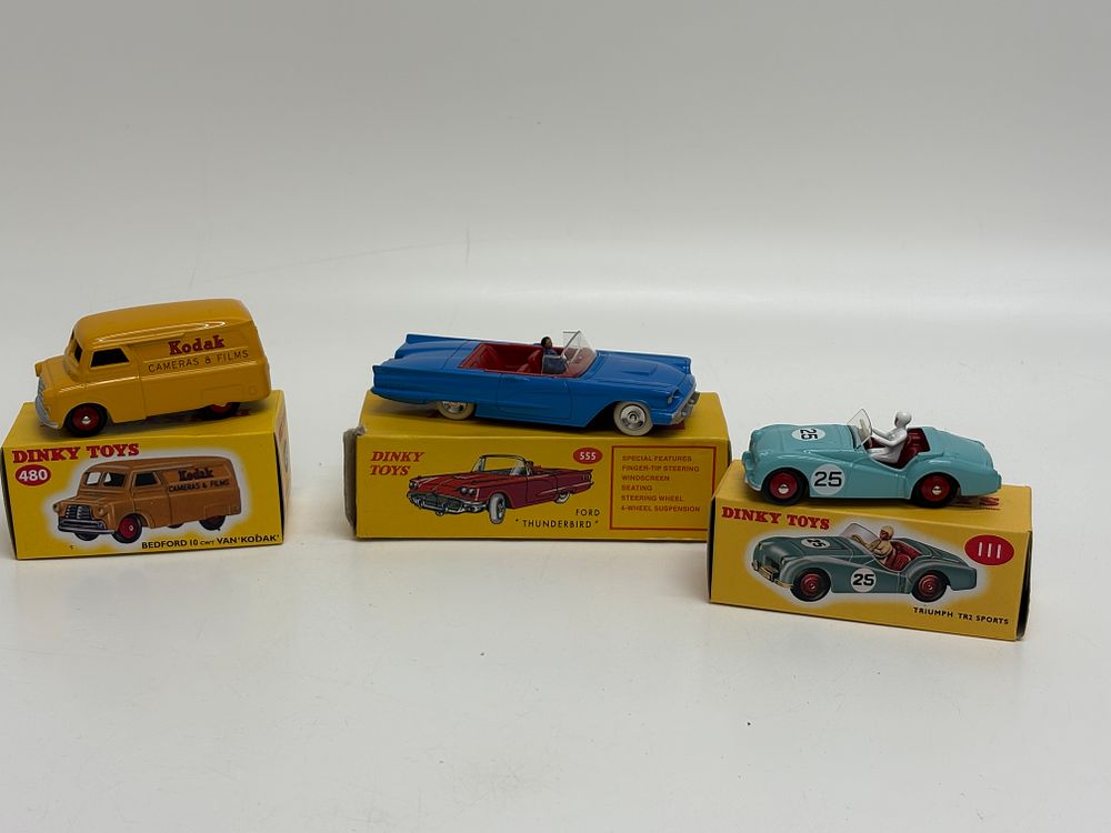 Lot 571: Three Dinky Toys Die-Cast Model Vehicles including Kodak Bedford Van, Ford Thunderbird, and Triumph TR2 Sports