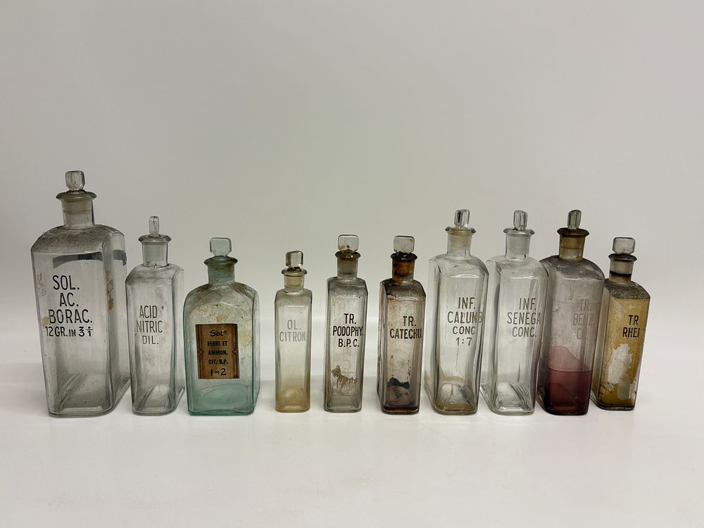 Lot 581: A Collection of Ten Antique Glass Apothecary Chemist Bottles with Ground Glass Stoppers