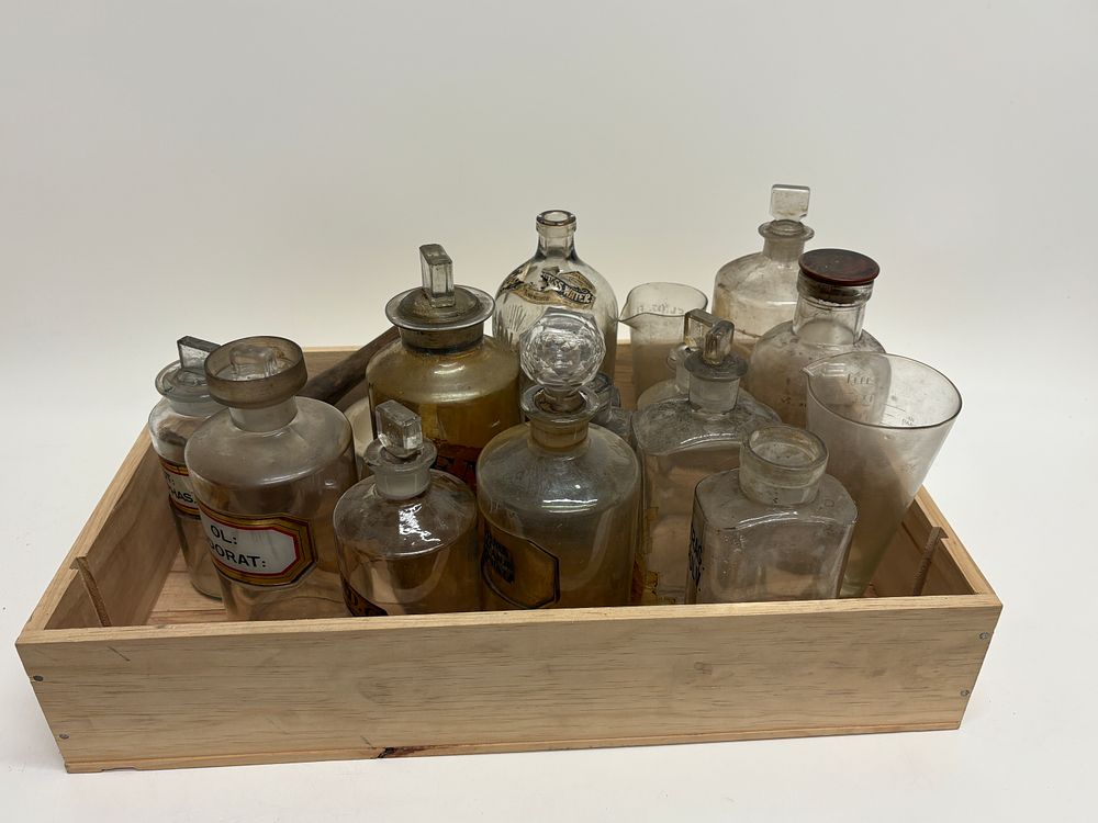 Lot 582: A Collection of Antique Apothecary and Chemist Bottles and Compounding Equipment