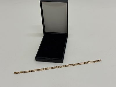A 9ct yellow gold Figaro link bracelet Total weight circa 2.73g. A 9ct yellow gold bracelet 