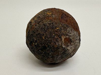 Cast Iron Solid Shot Cannonball. A single cast iron spherical projectile, identified as a solid 