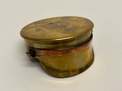 A World War I British Trench Art Peaked Cap Fashioned from an 18-Pounder Shell Case. A World War 