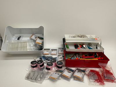An Assortment of Fishing Tackle and Accessories with a Plano Two-Tray Cantilever Tackle Box. An 
