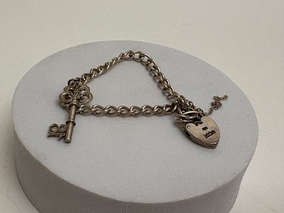 A Vintage Hallmarked Sterling Silver Curb-Link Charm Bracelet with Heart Padlock Clasp and 18th 