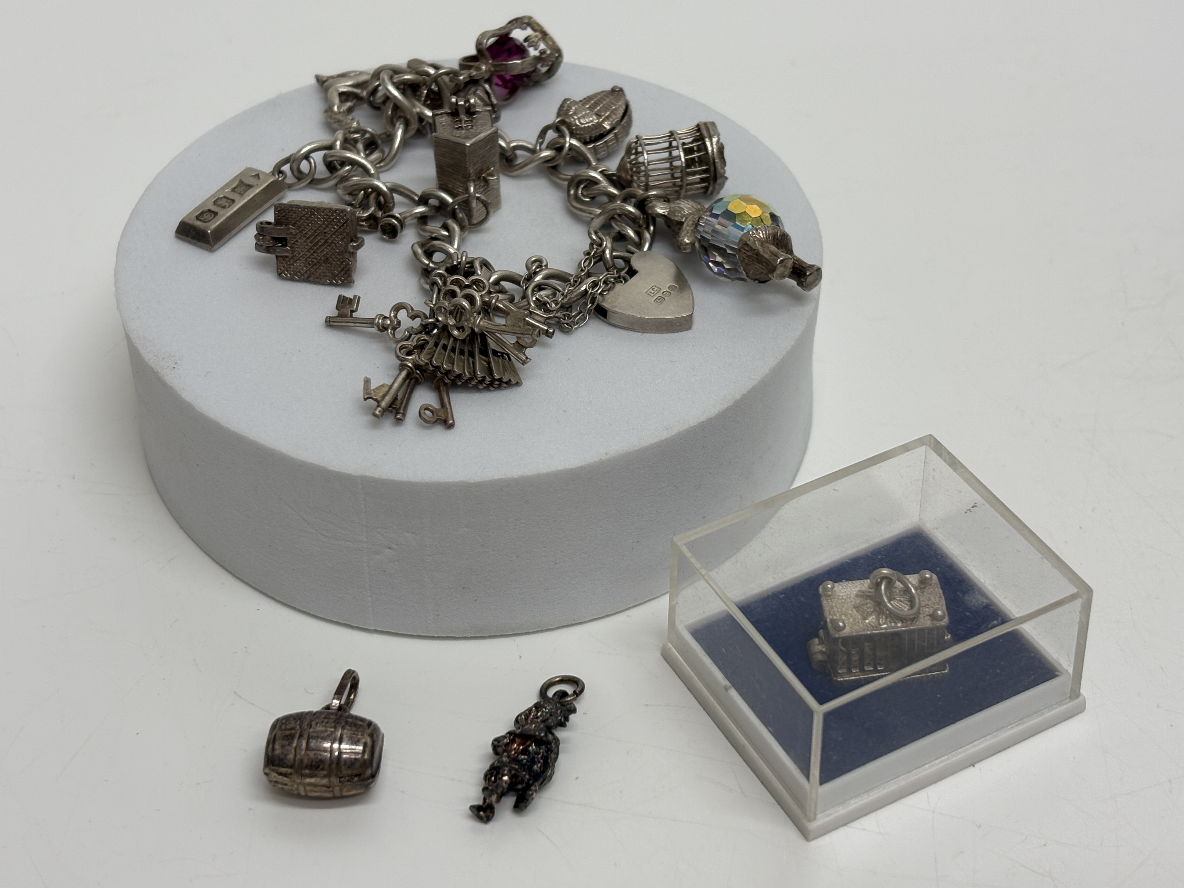 A Collection of Vintage Sterling Silver Bracelt with Silver & White Metal Charms Gross circa 53.4g