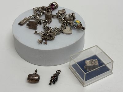A Collection of Vintage Sterling Silver Bracelt with Silver & White Metal Charms Gross circa 53.4g. 