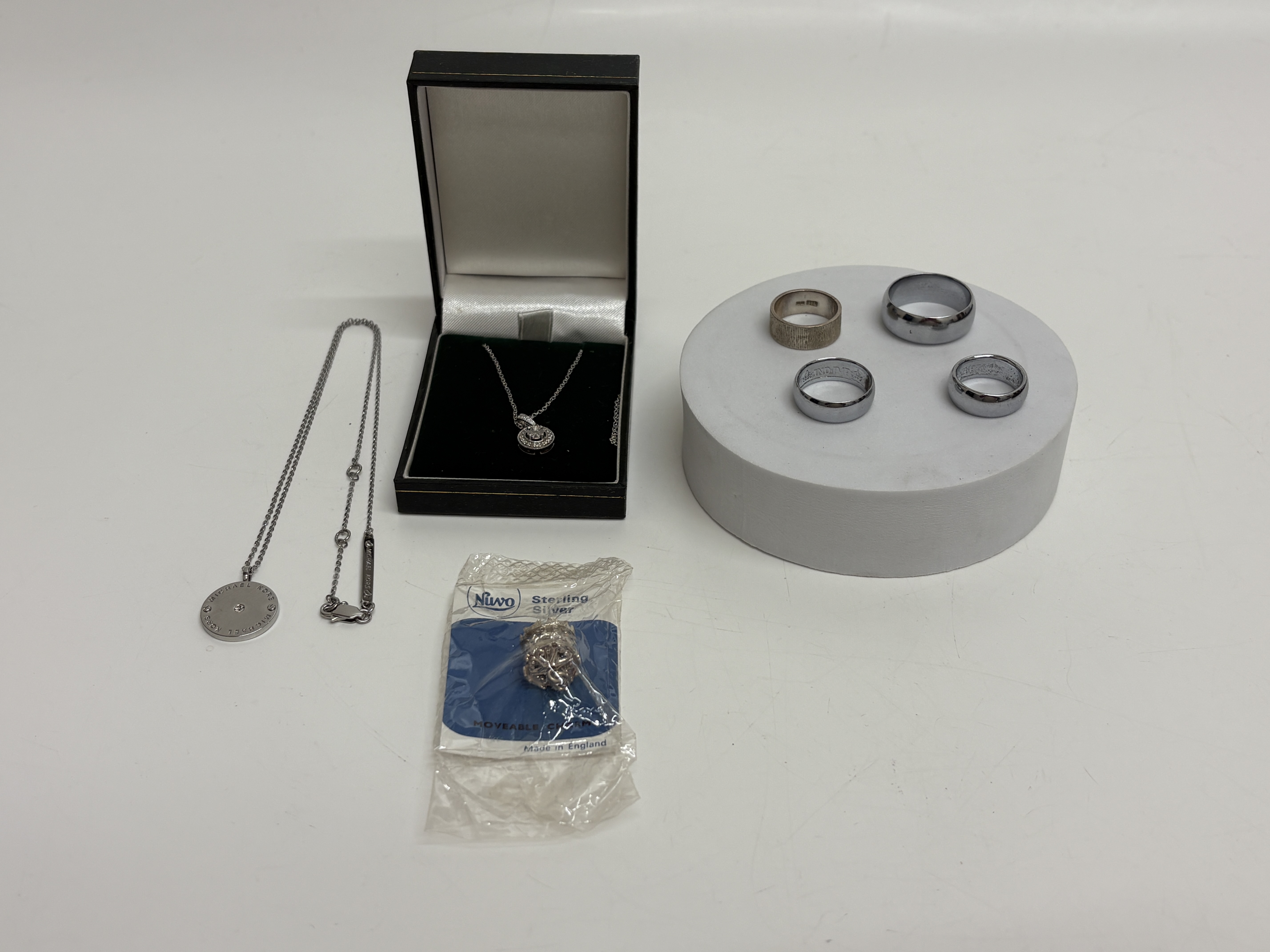 An Assortment of Michael Kors and Sterling Silver Jewellery & Florin Rings