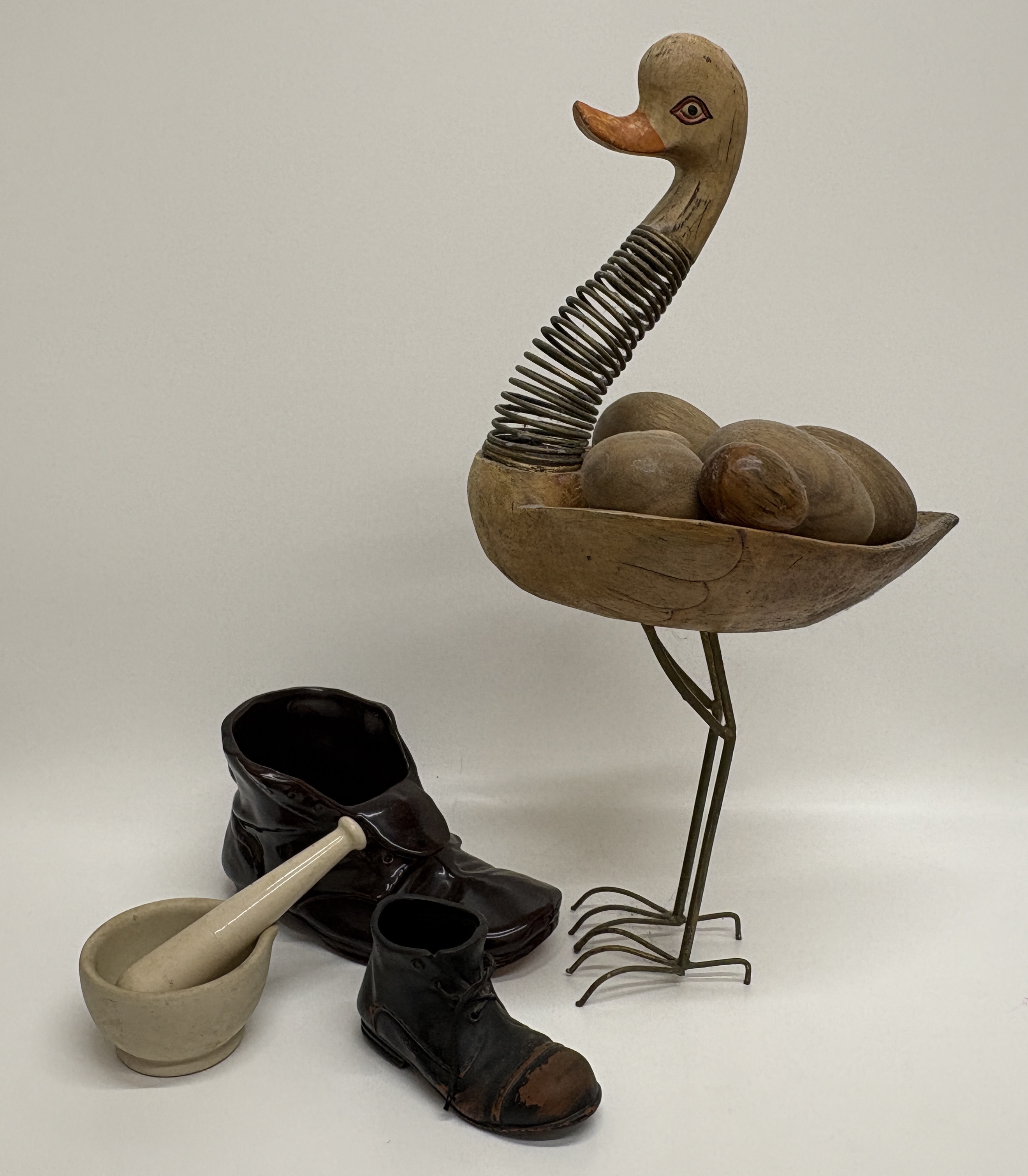 A Collection of Decorative Items Including a Bamboo and Wood Bird Sculpture and Ceramic Boot-Form Vessel