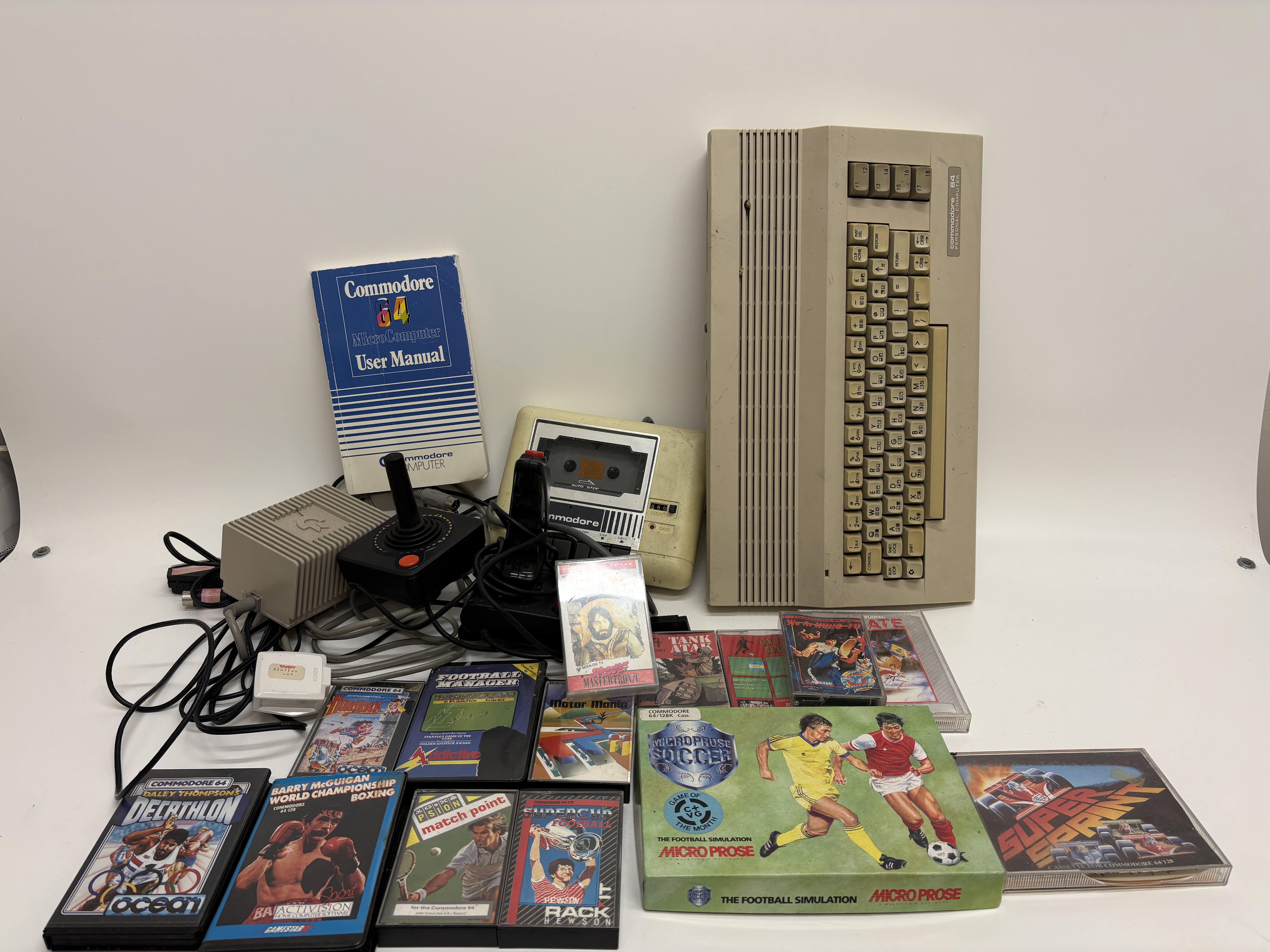 A Commodore 64C Personal Computer System with Datassette, Joysticks, and a Collection of Software