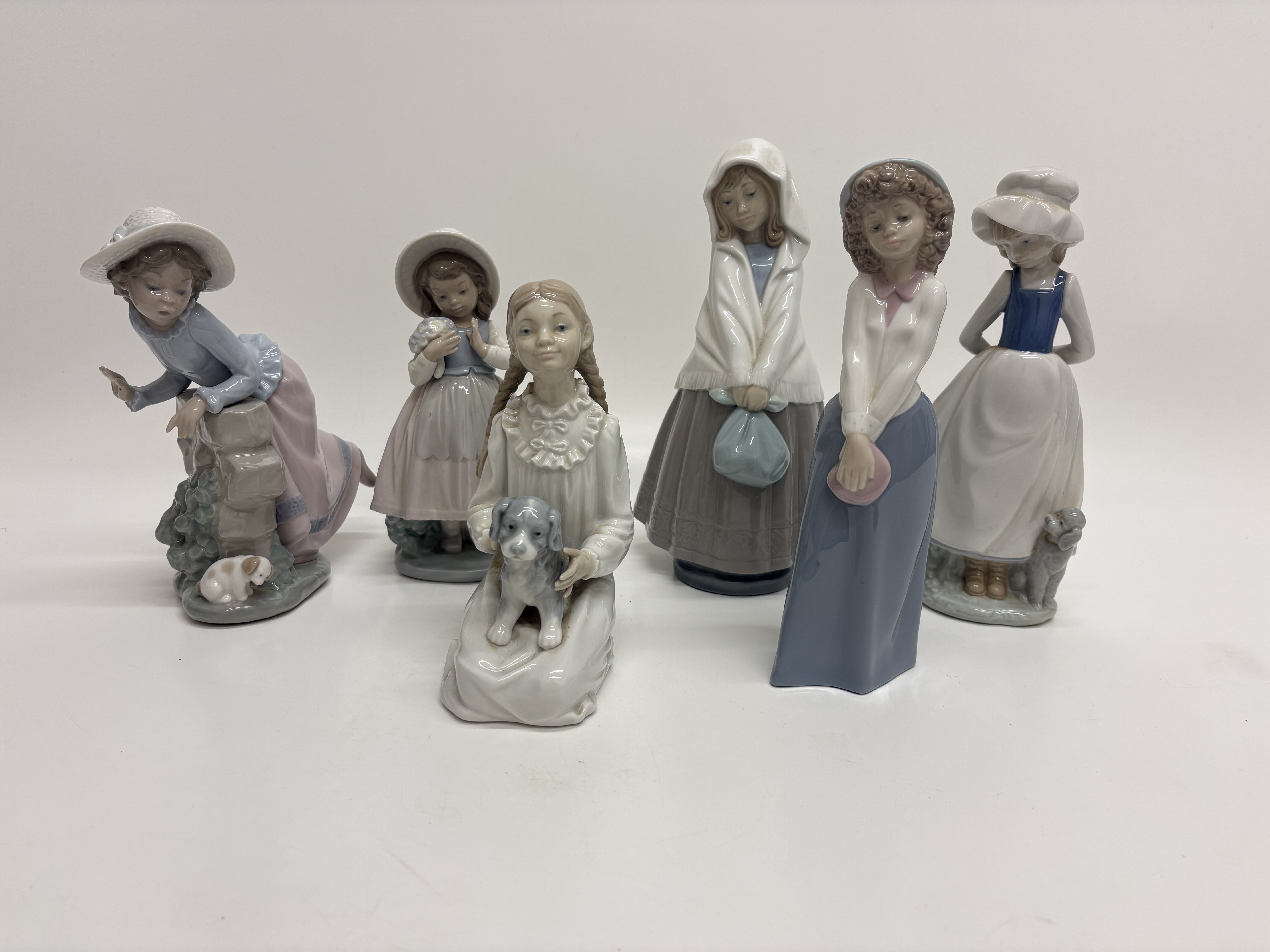 A Collection of Six Nao by Lladro Porcelain Figurines of Young Girls