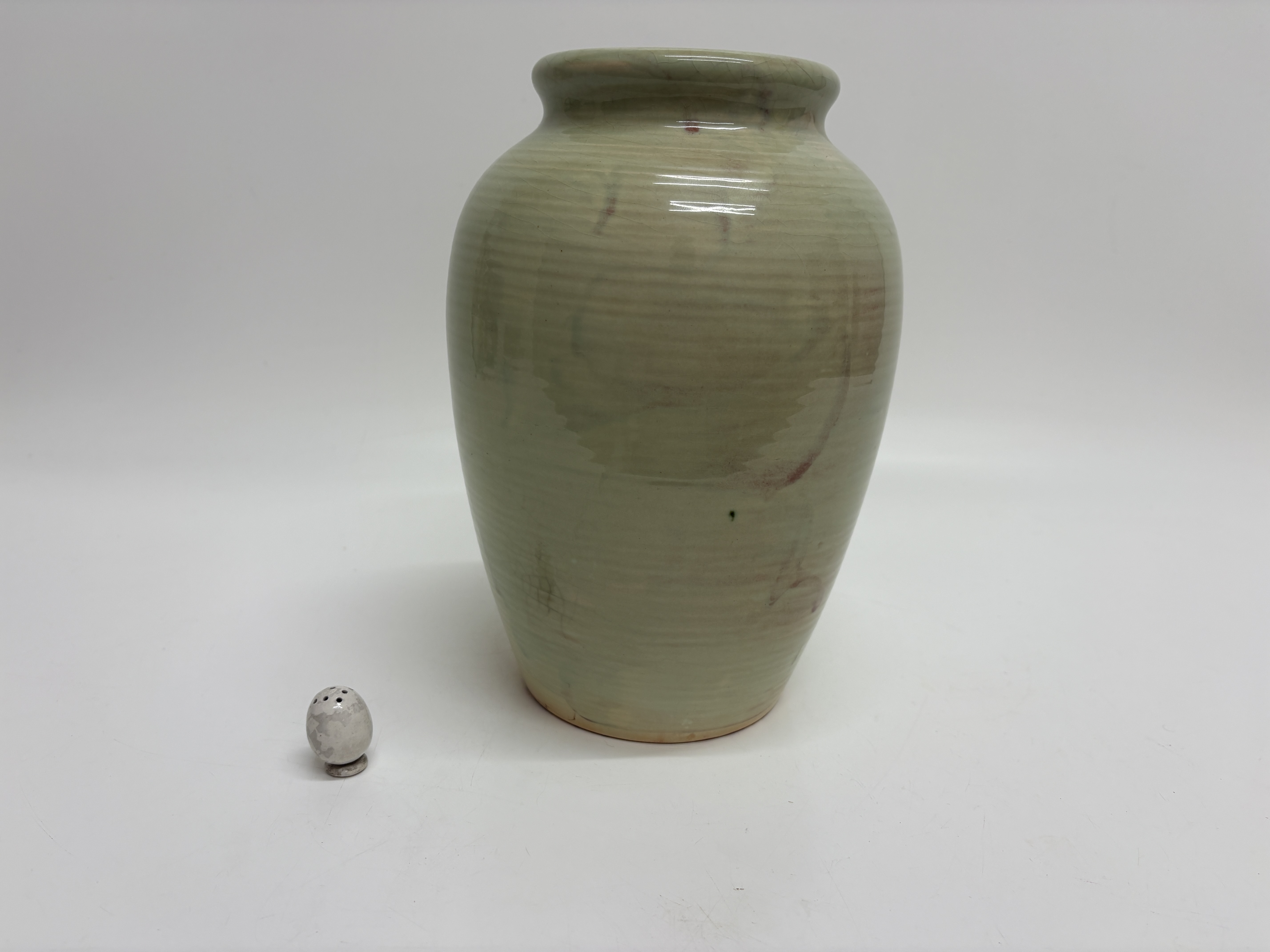 Two ceramic items comprising a 
vase by Moorcroft 24cm and an egg-shaped salt/pepper shaker