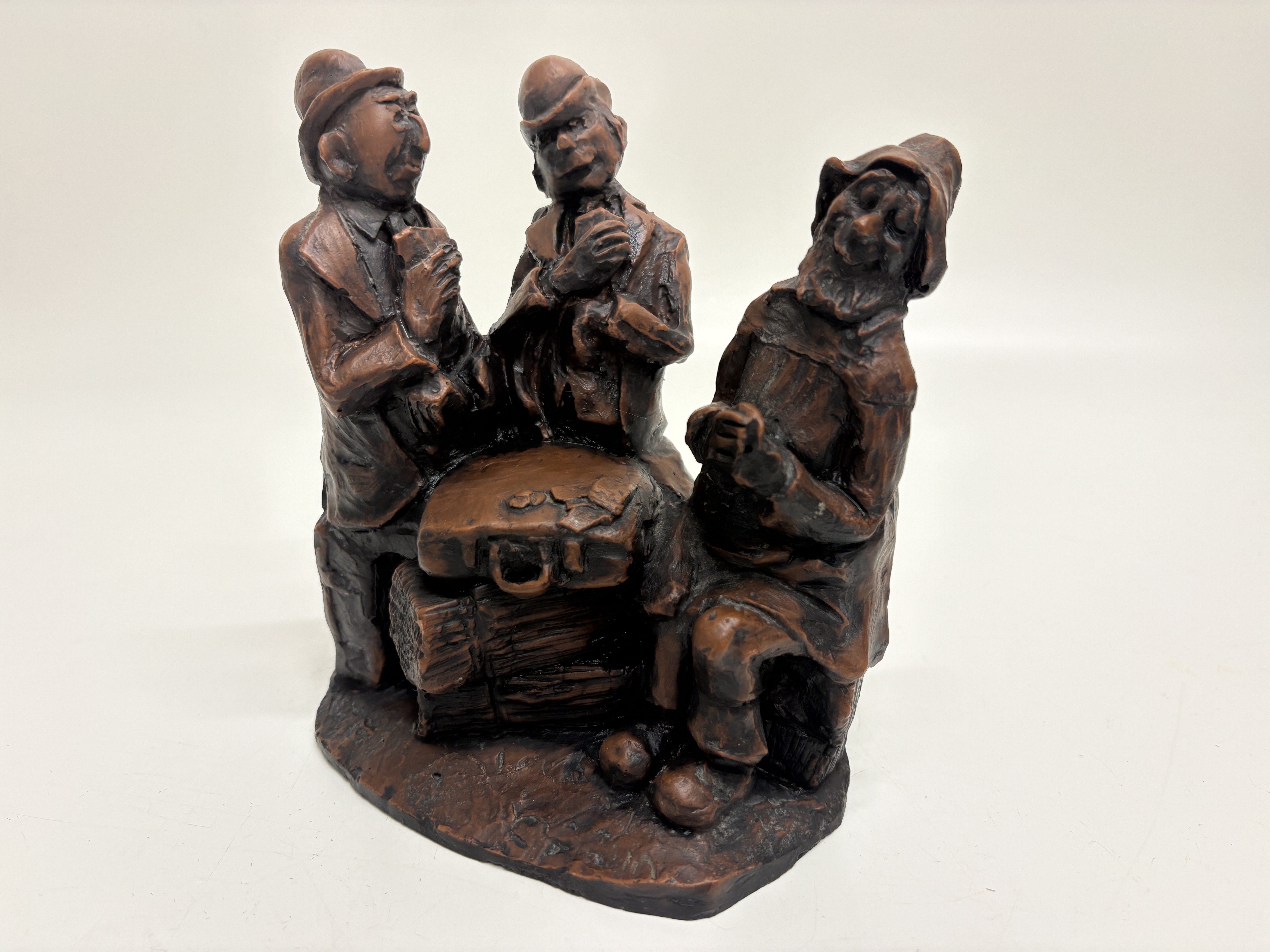 A Cast Composite Figurative Sculpture of Card Players