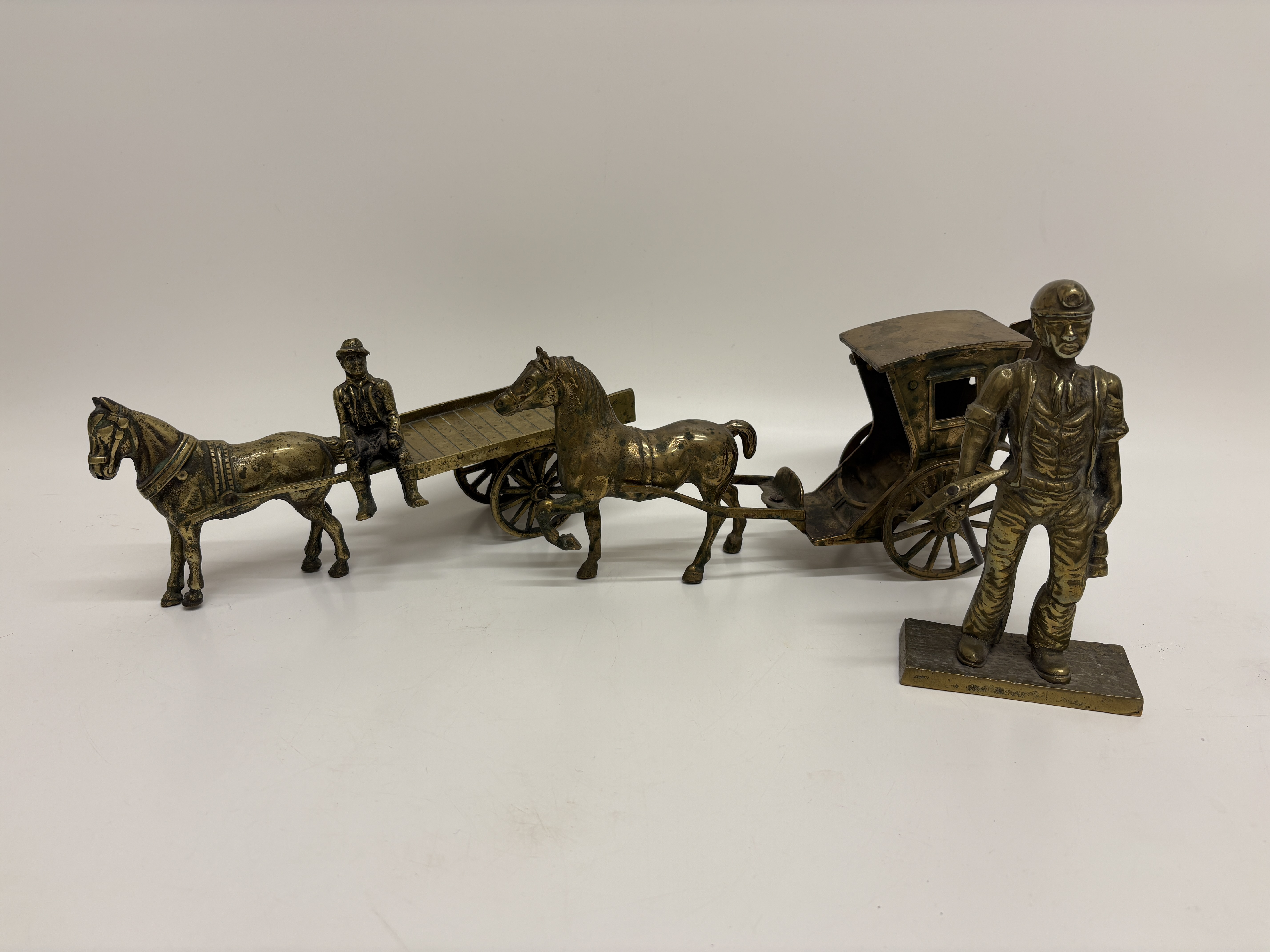 A Collection of Cast Brass Miniature Figures and Transport Models