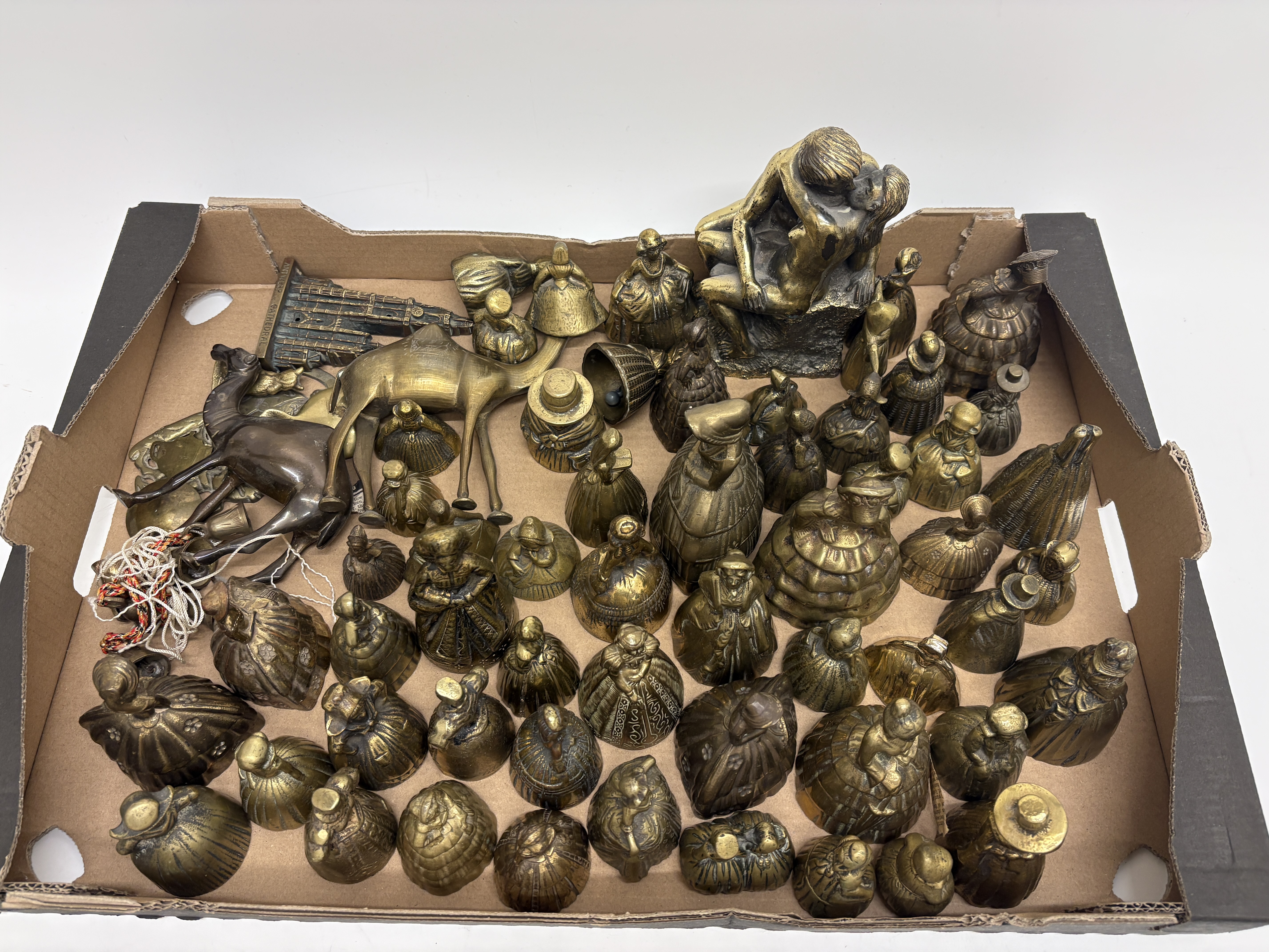 A Collection of Cast Brass Figural Table Bells and Metalware 14kilos