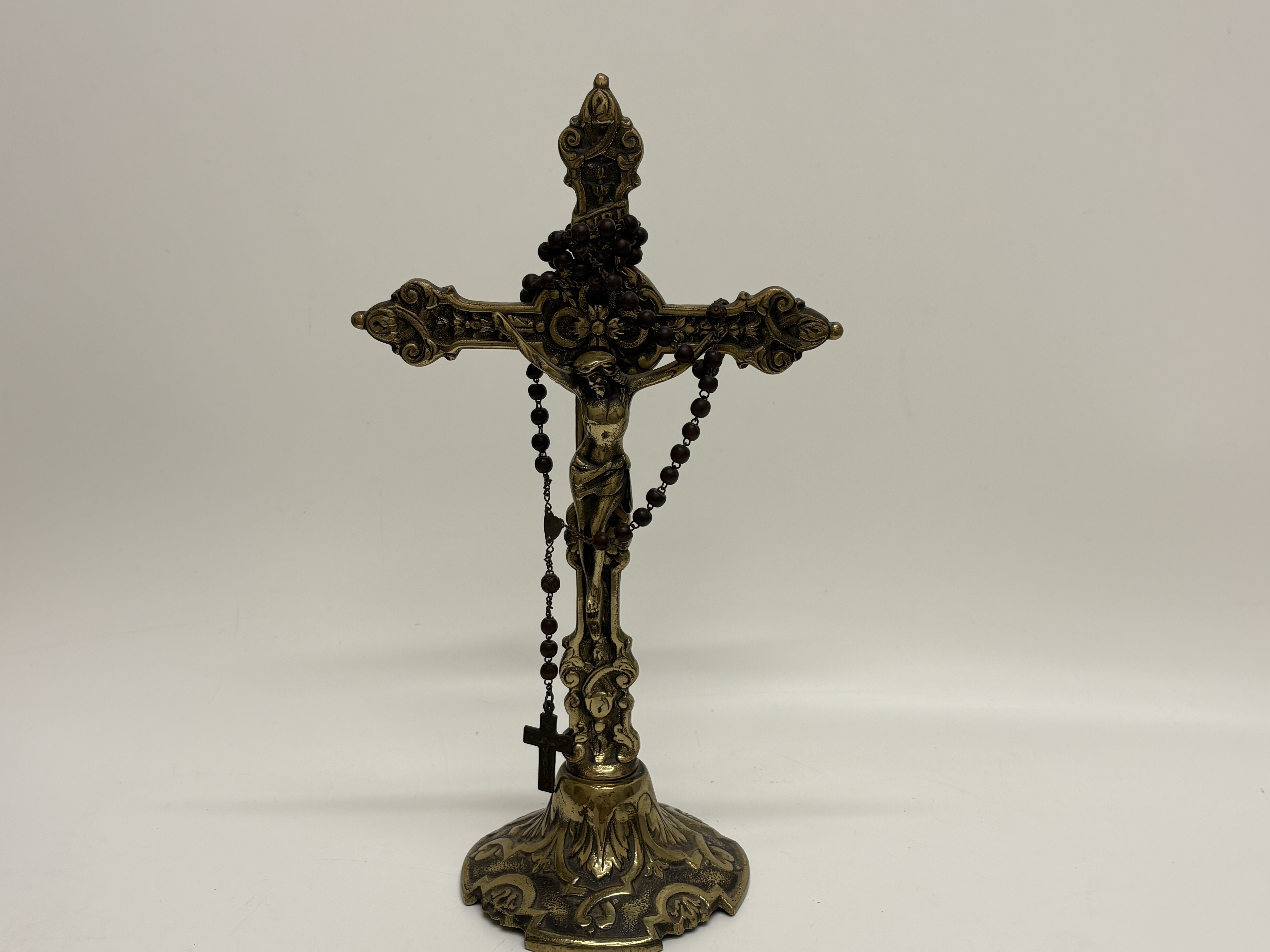 An Ornate Standing Brass Altar Crucifix and Wooden Bead Rosary 33cm high
