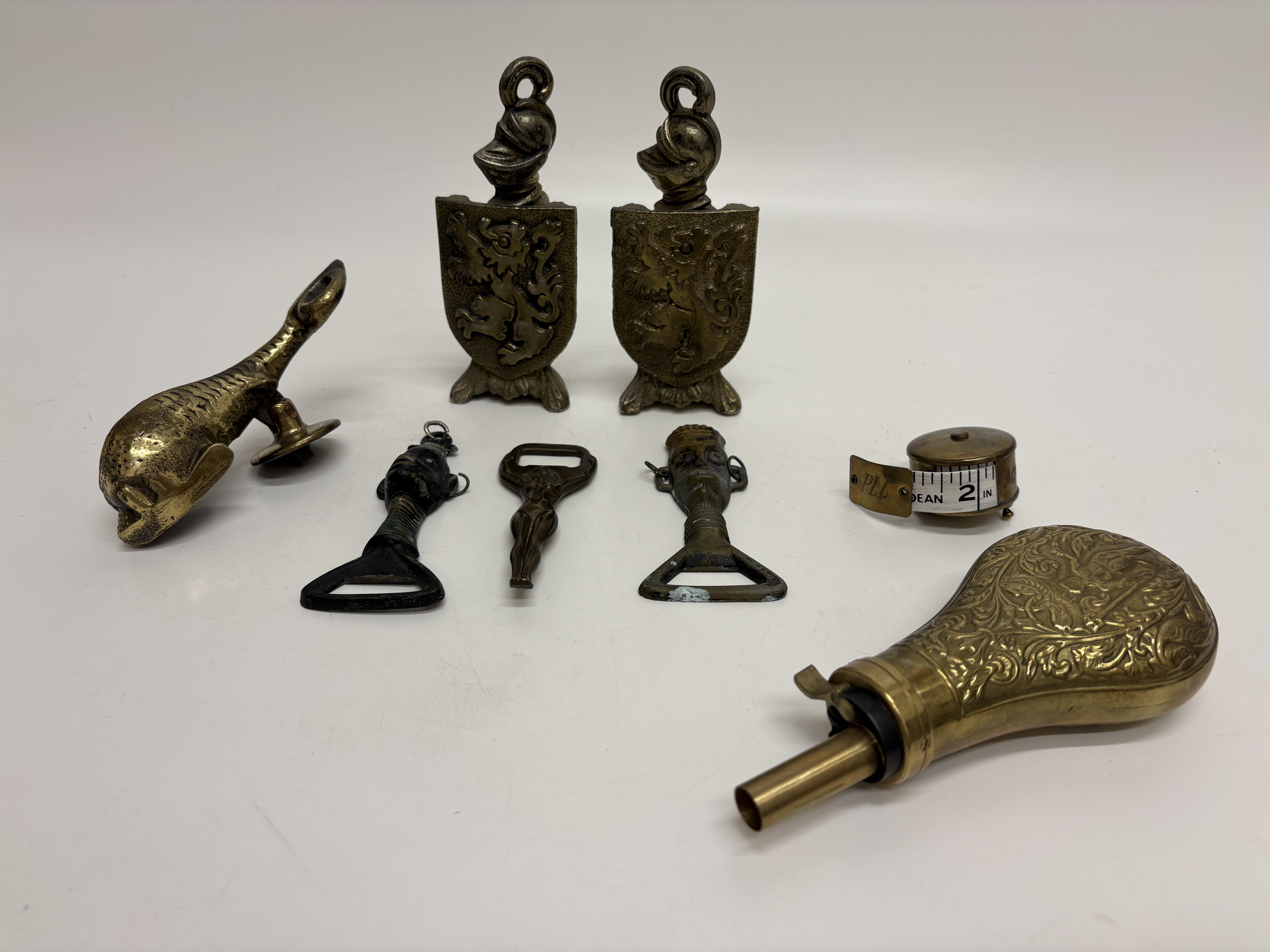 An Assortment of Decorative Brass and Metal Items including a Reproduction Powder Flask and a Beetle Boot Jack