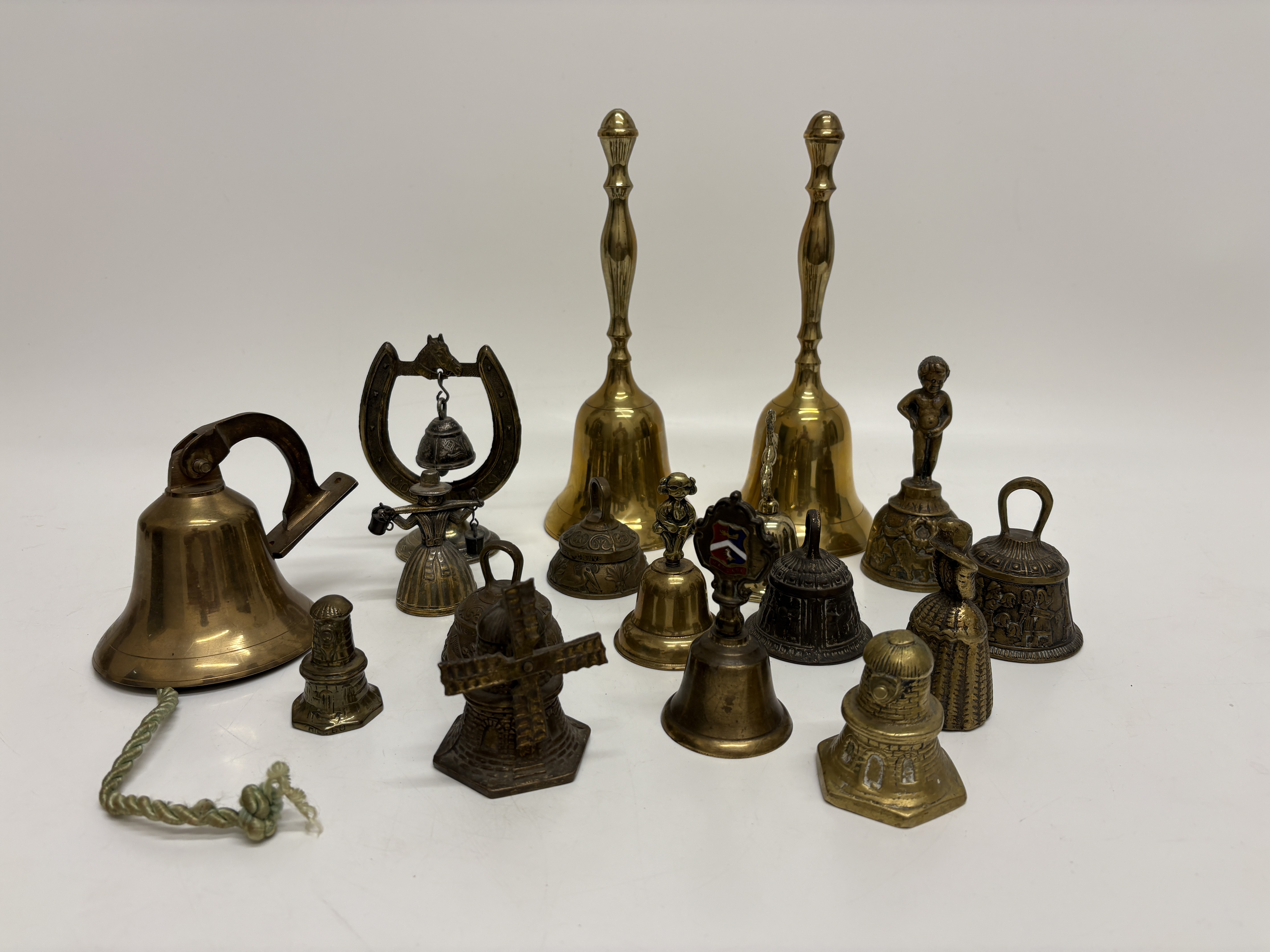 An Assortment of Decorative Brass and Patinated Metal Novelty Bells