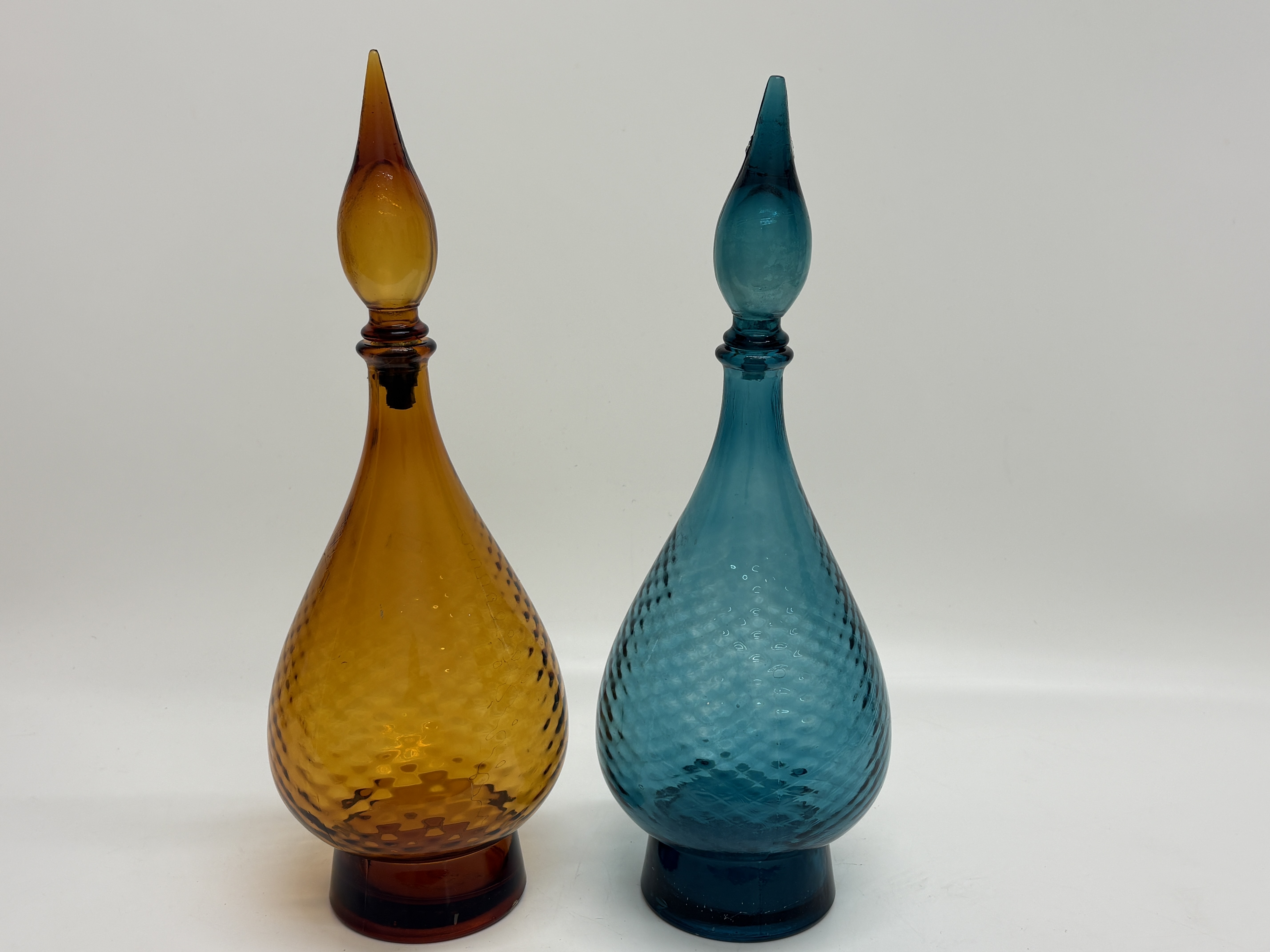 A pair of mid-century Italian Empoli glass genie bottle decanters 44cm high