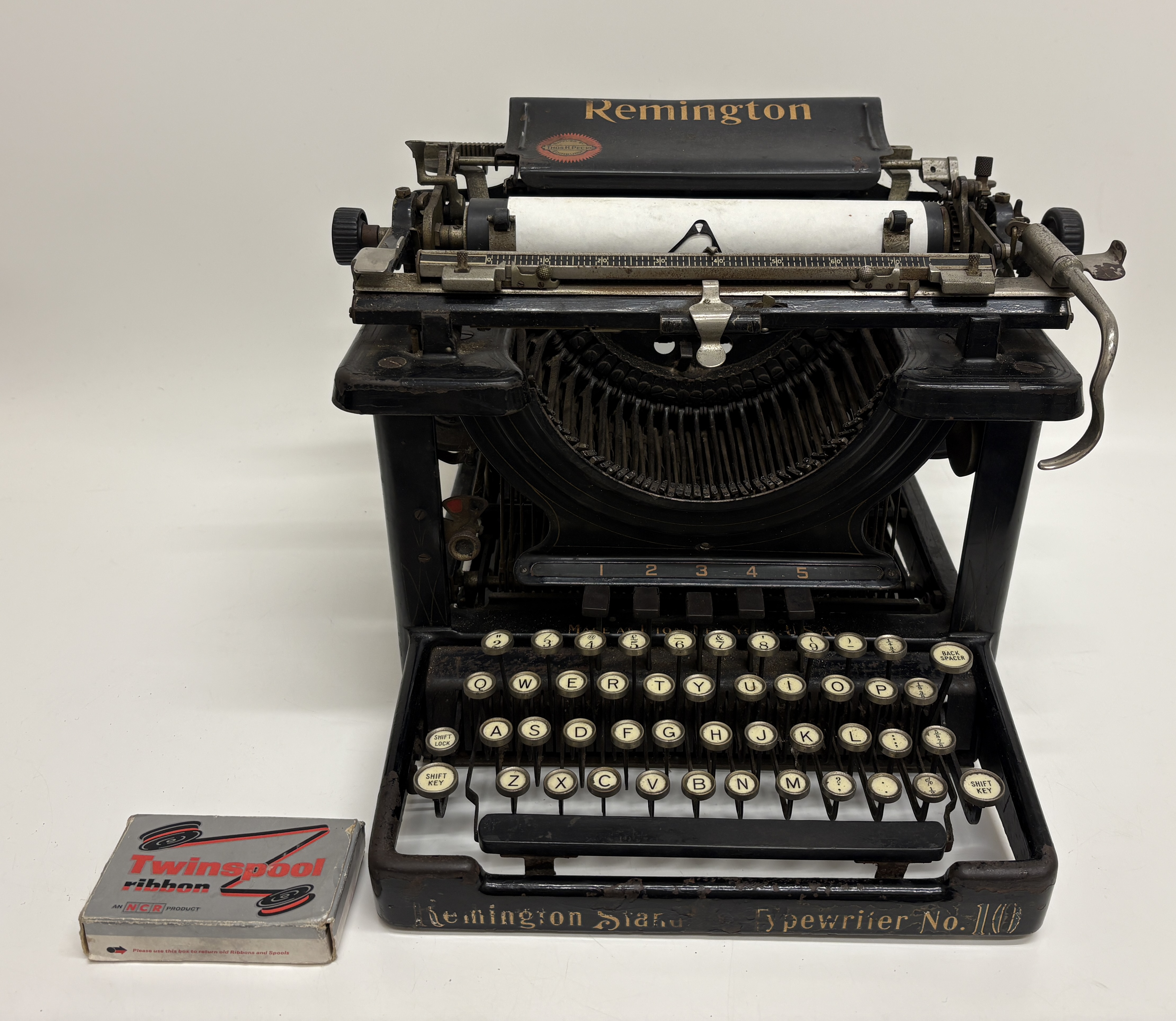 A Remington Standard Typewriter No. 10 and an NCR Twinspool Ribbon Box
