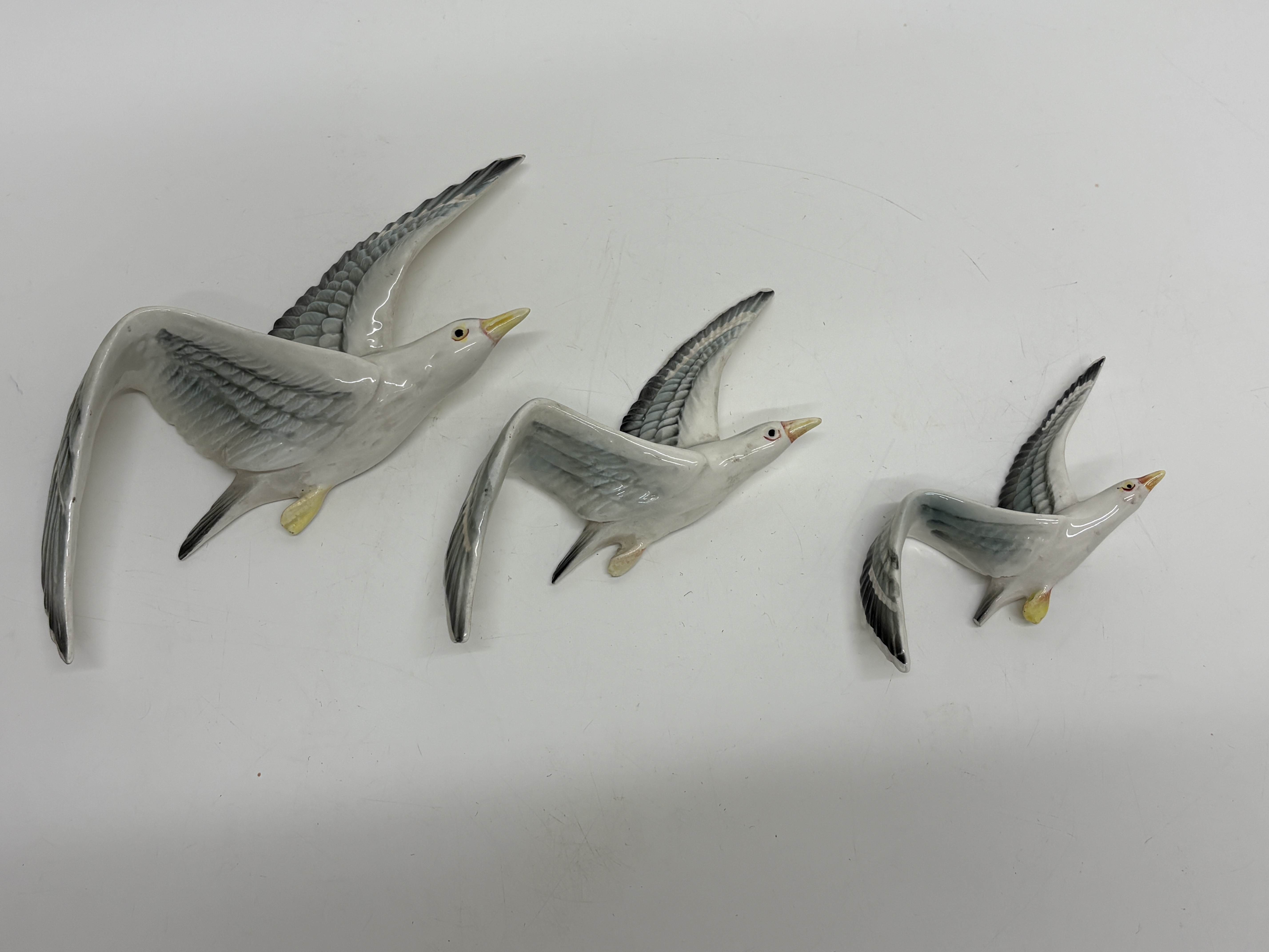 A Trio of Graduated Ceramic Flying Seagull Wall Plaques
