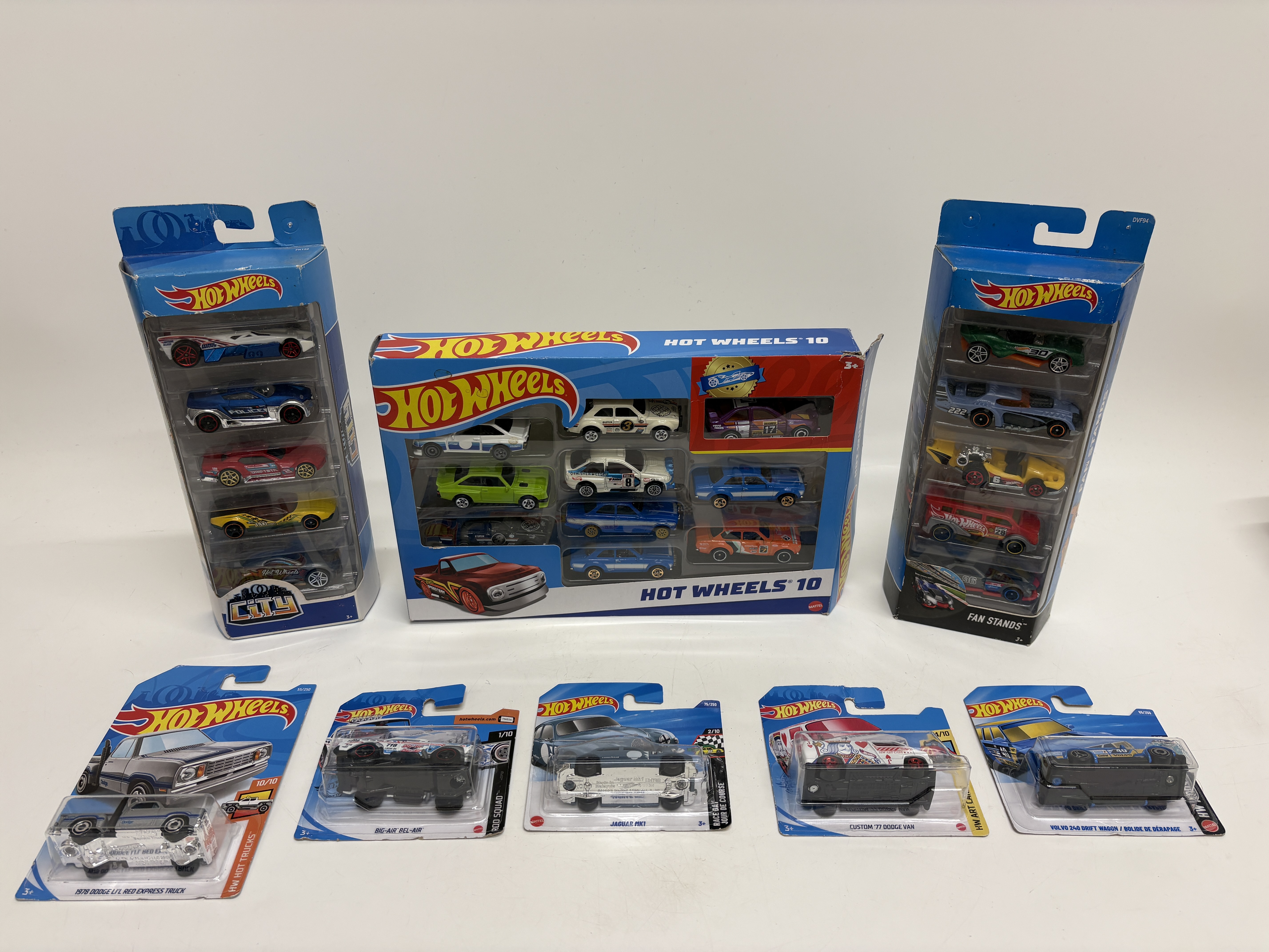 A collection of twenty-five Hot Wheels die-cast model vehicles by Mattel including multi-car sets and individual carded models