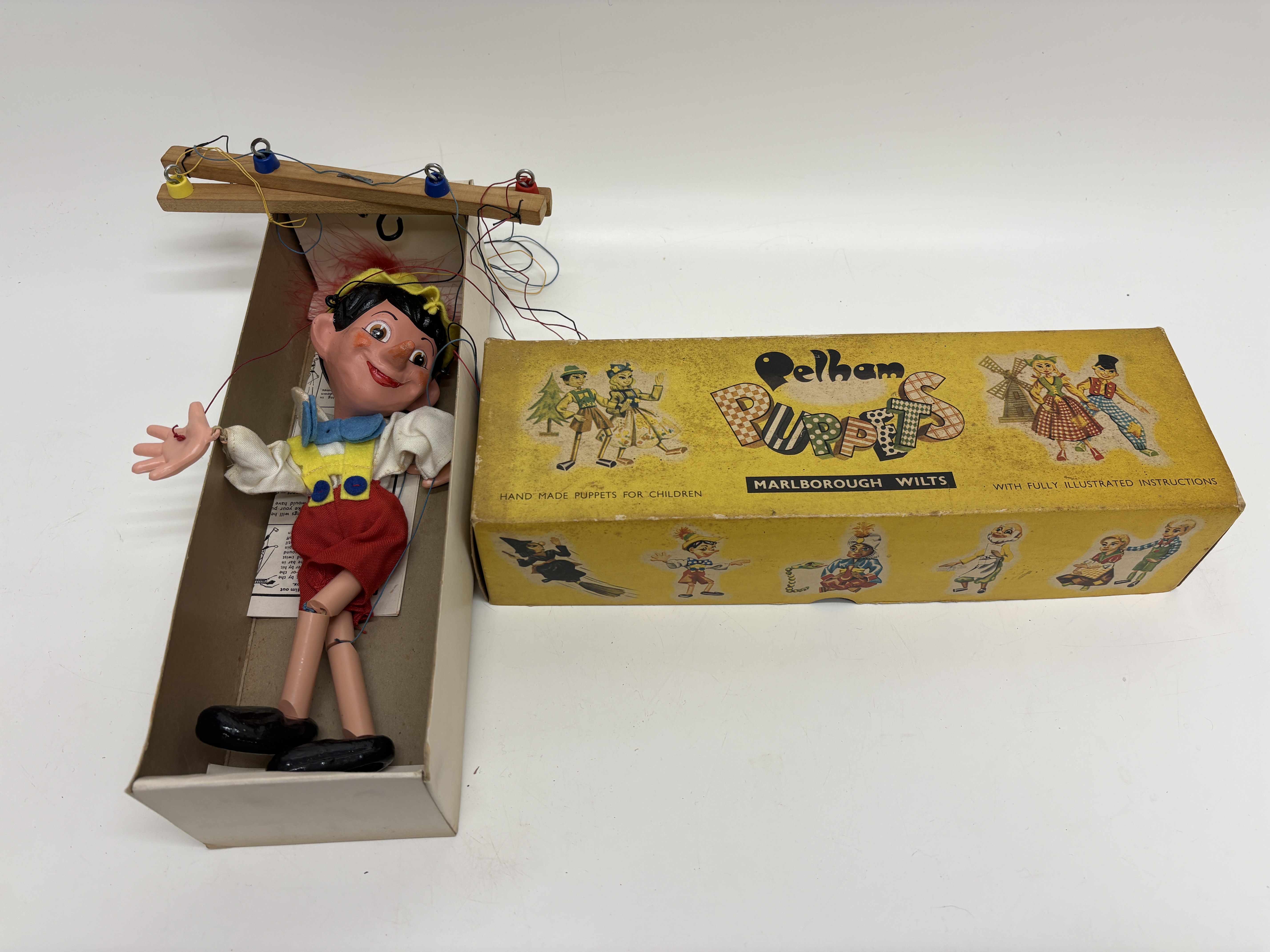 A Pelham Puppets SL Pinocchio marionette with original box and instructions