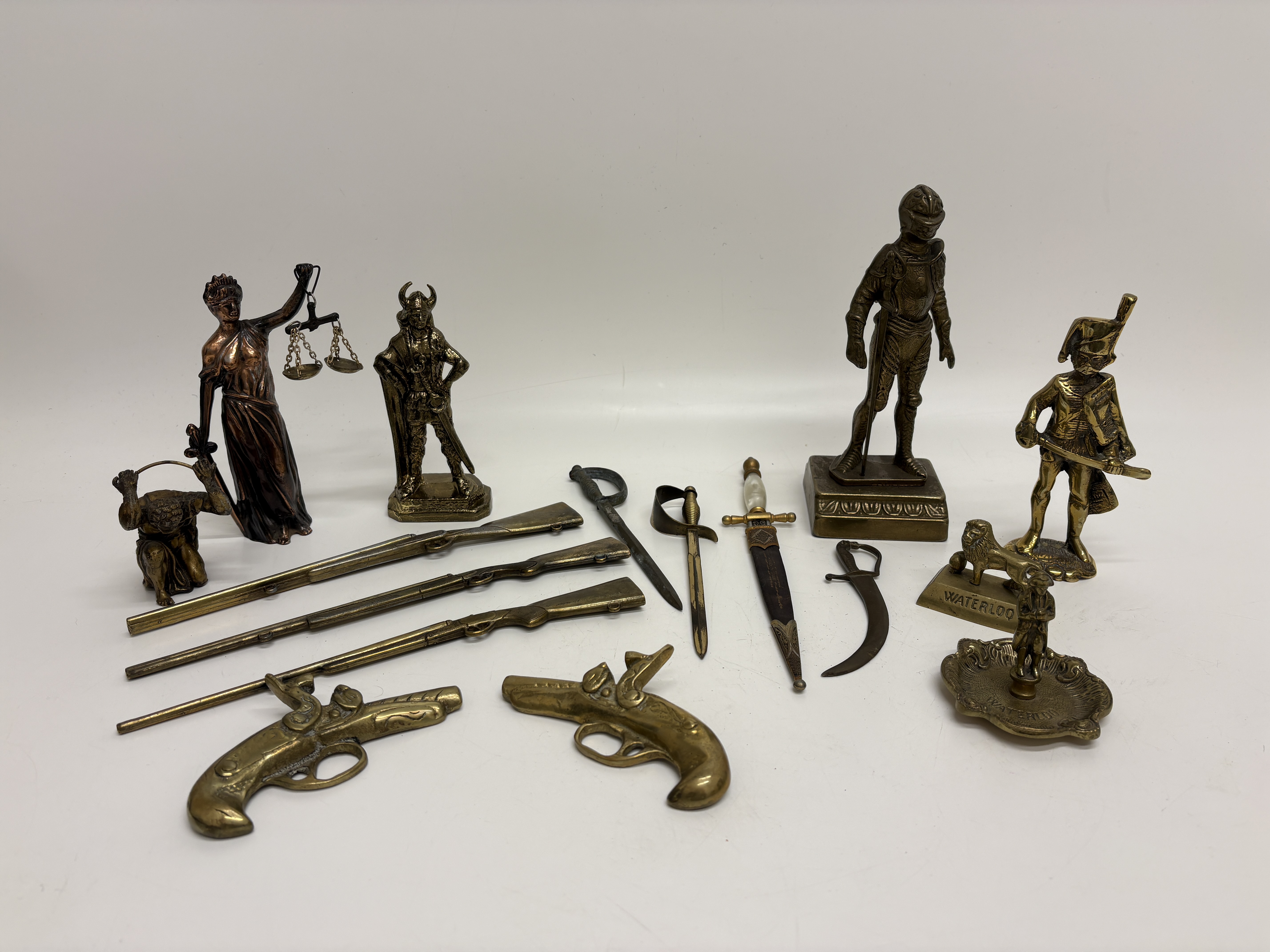A Collection of 14 Vintage Miniature Cast Brass and Bronze-Toned Historical Figures and Scale Weapons