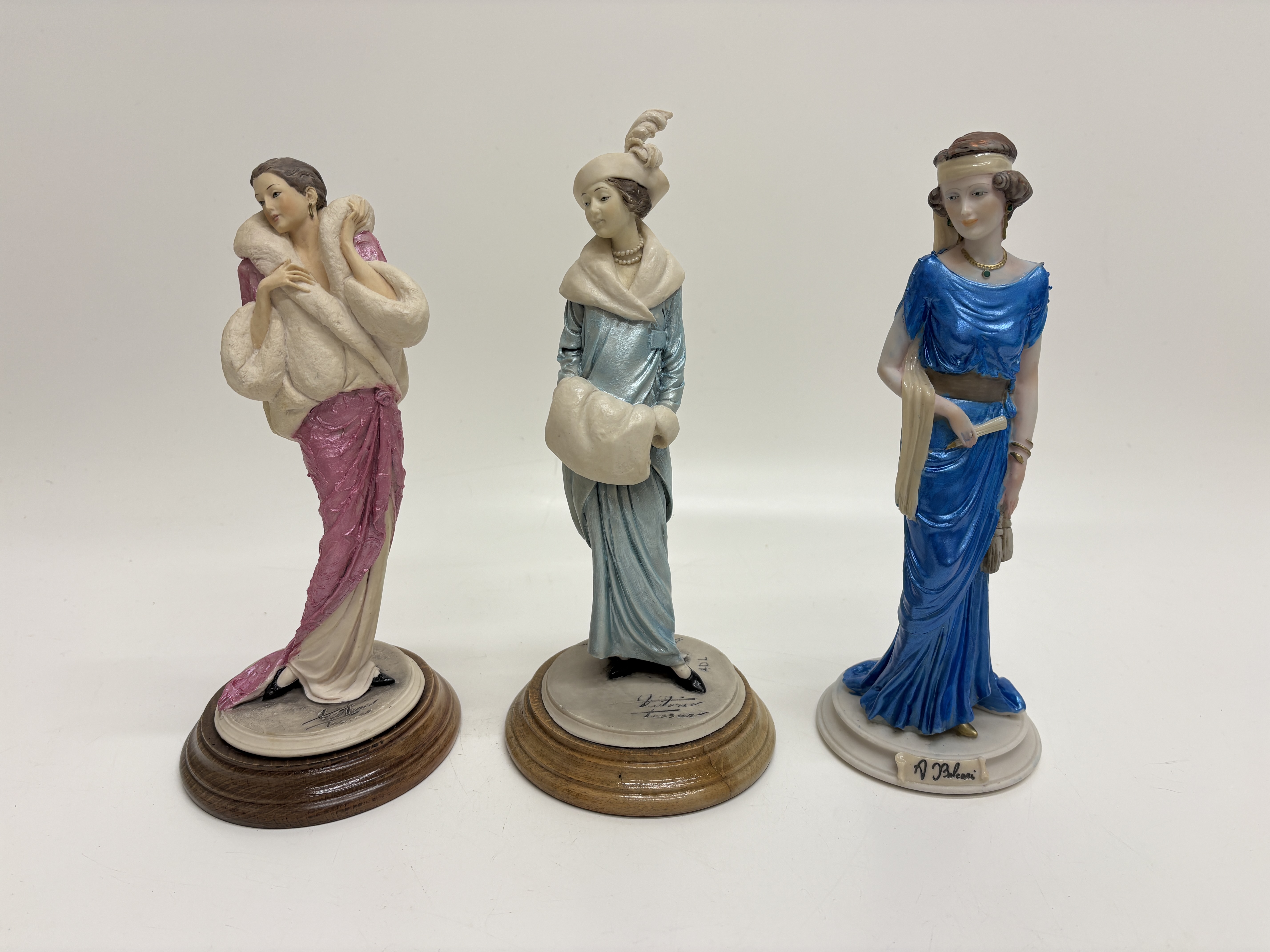 Three Italian Cold-Cast Resin Figurines including Examples by Auro Belcari and A.D.L. Italy