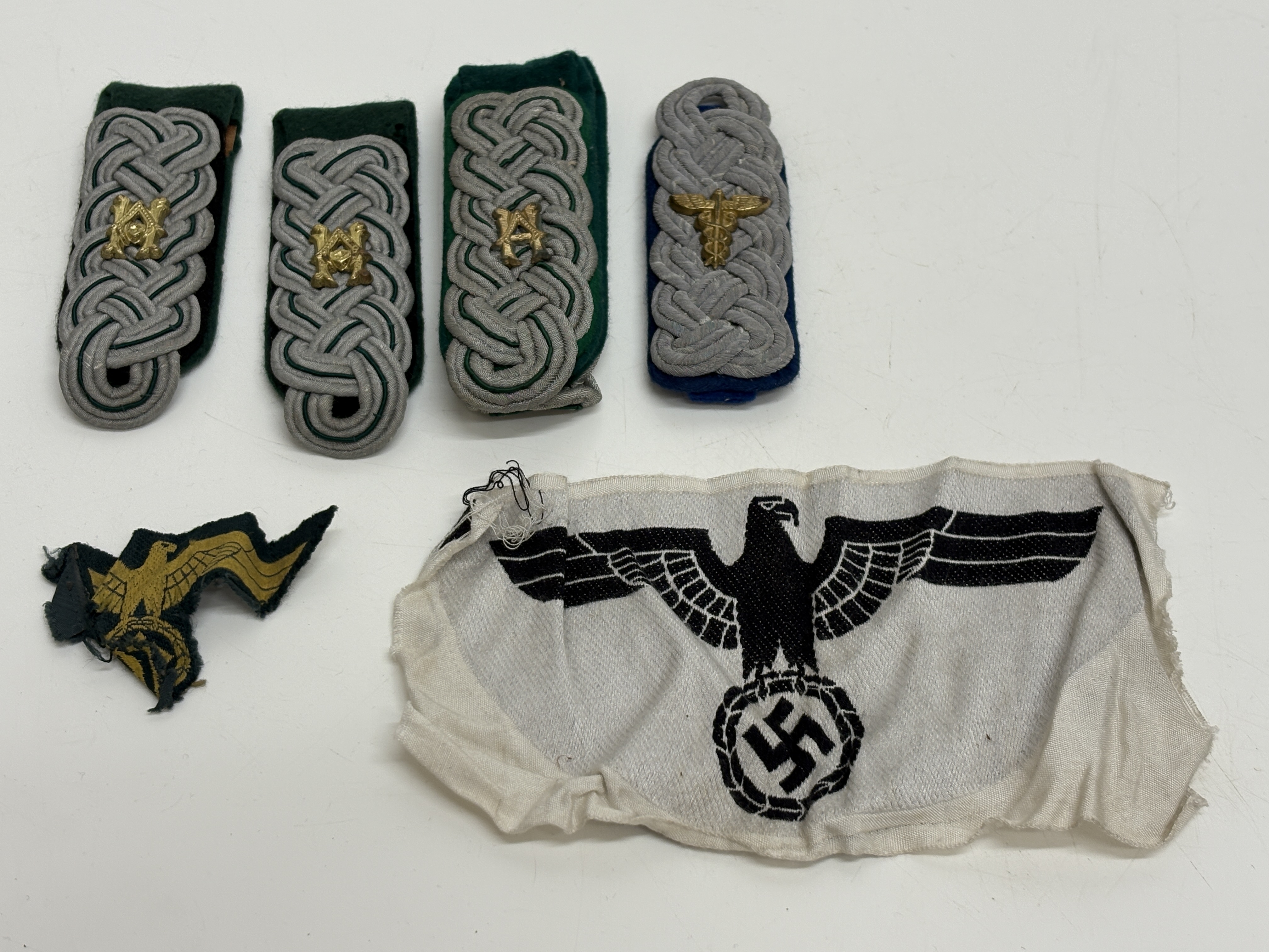A Collection of WWII German Heer Army Officer Shoulder Boards and Uniform Insignia