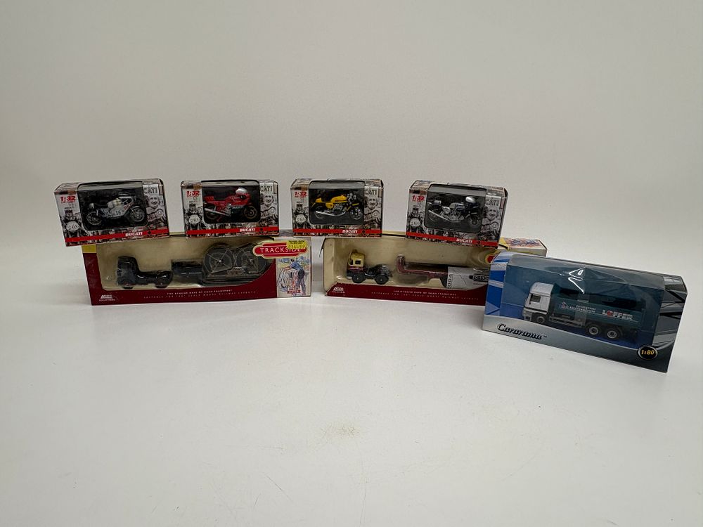 Lot 473: A Collection of Seven Boxed Die-Cast Models by NewRay, Lledo and Cararama