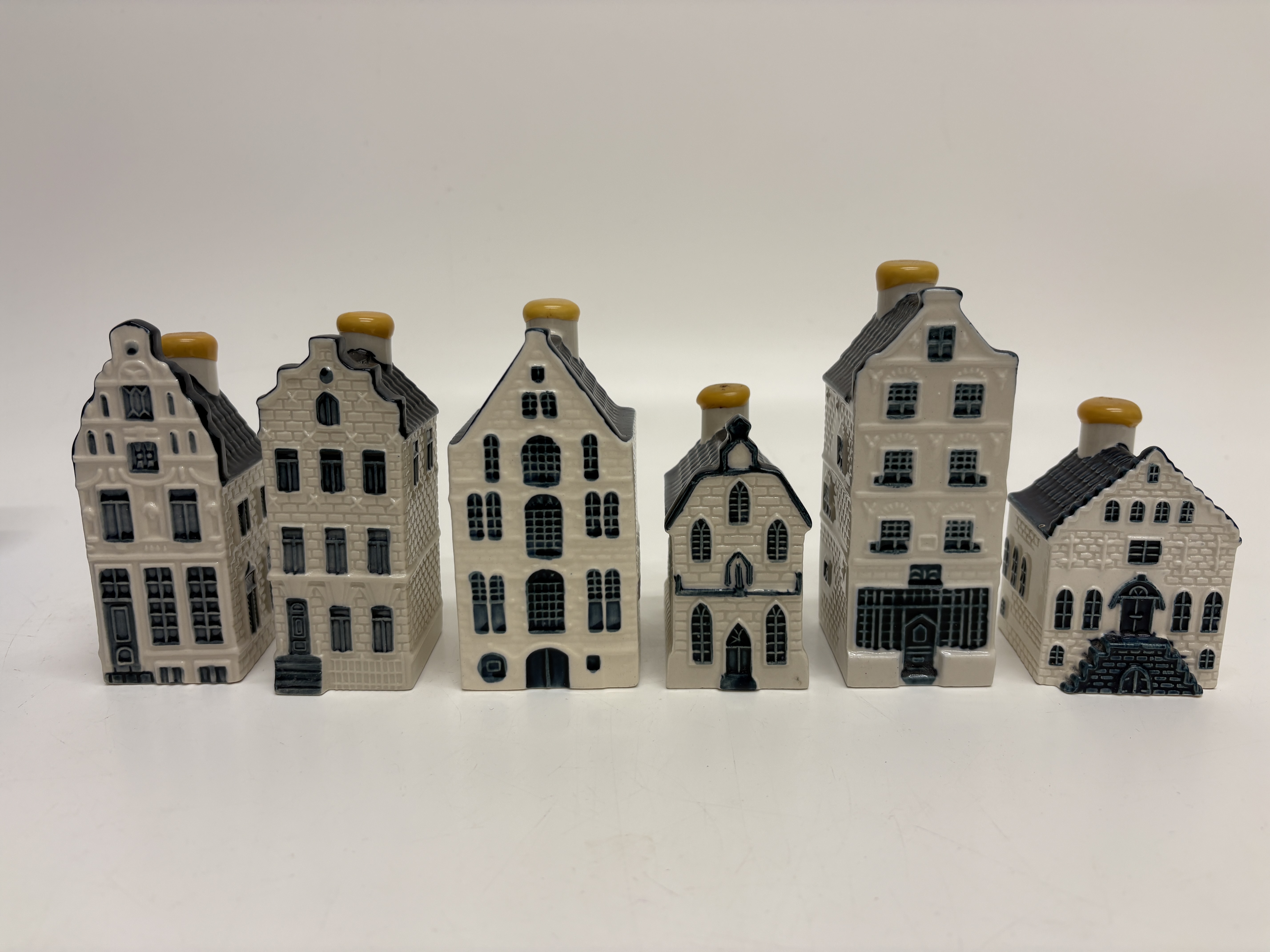 A set of six KLM Royal Dutch Airlines Delft Blue miniature houses by Bols