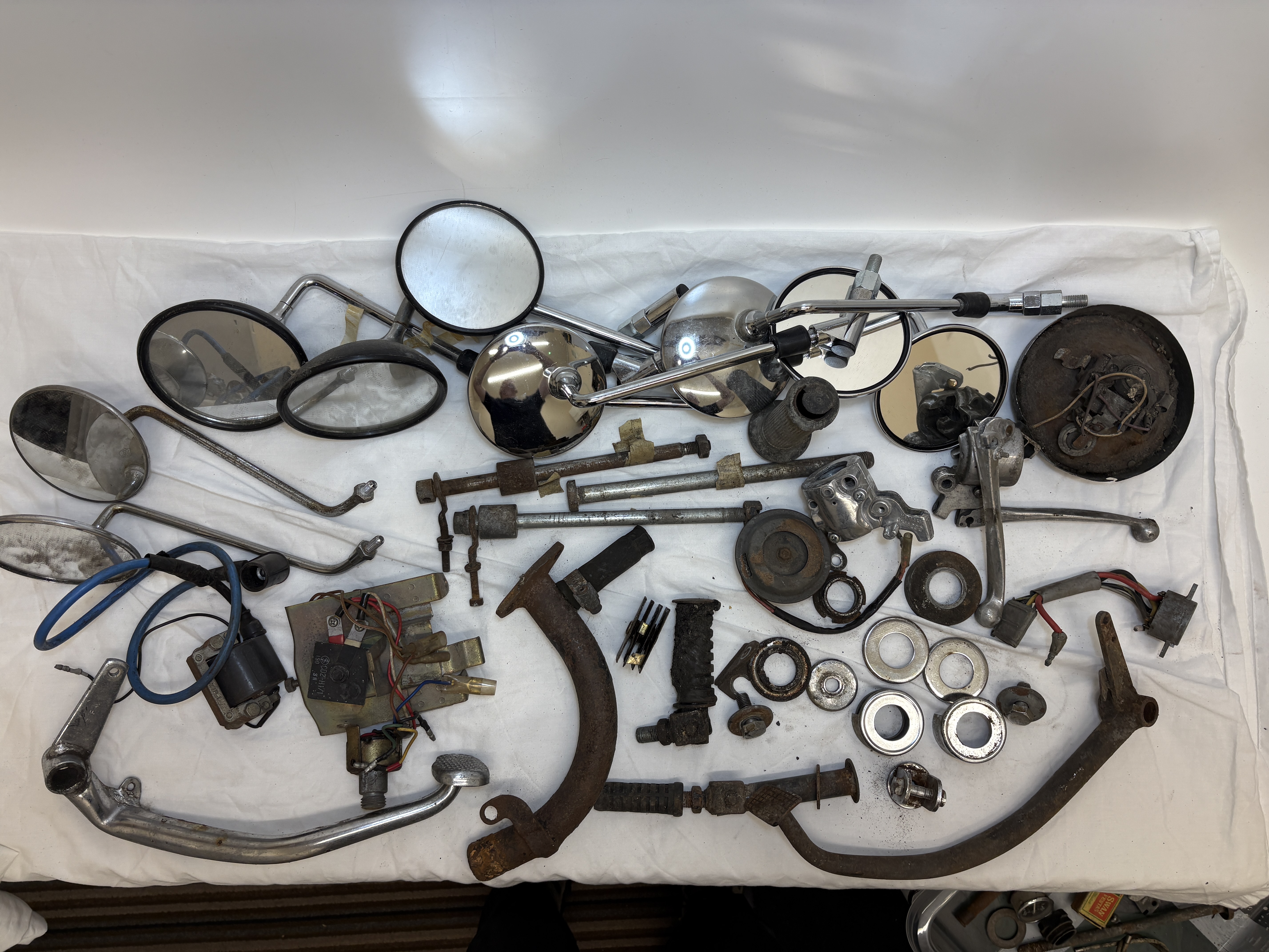 A Collection of Approximately 50 Vintage Japanese Motorcycle Parts and Hardware Including Yamaha FS1E 1974/75 (N Plate) and other mixed spares
