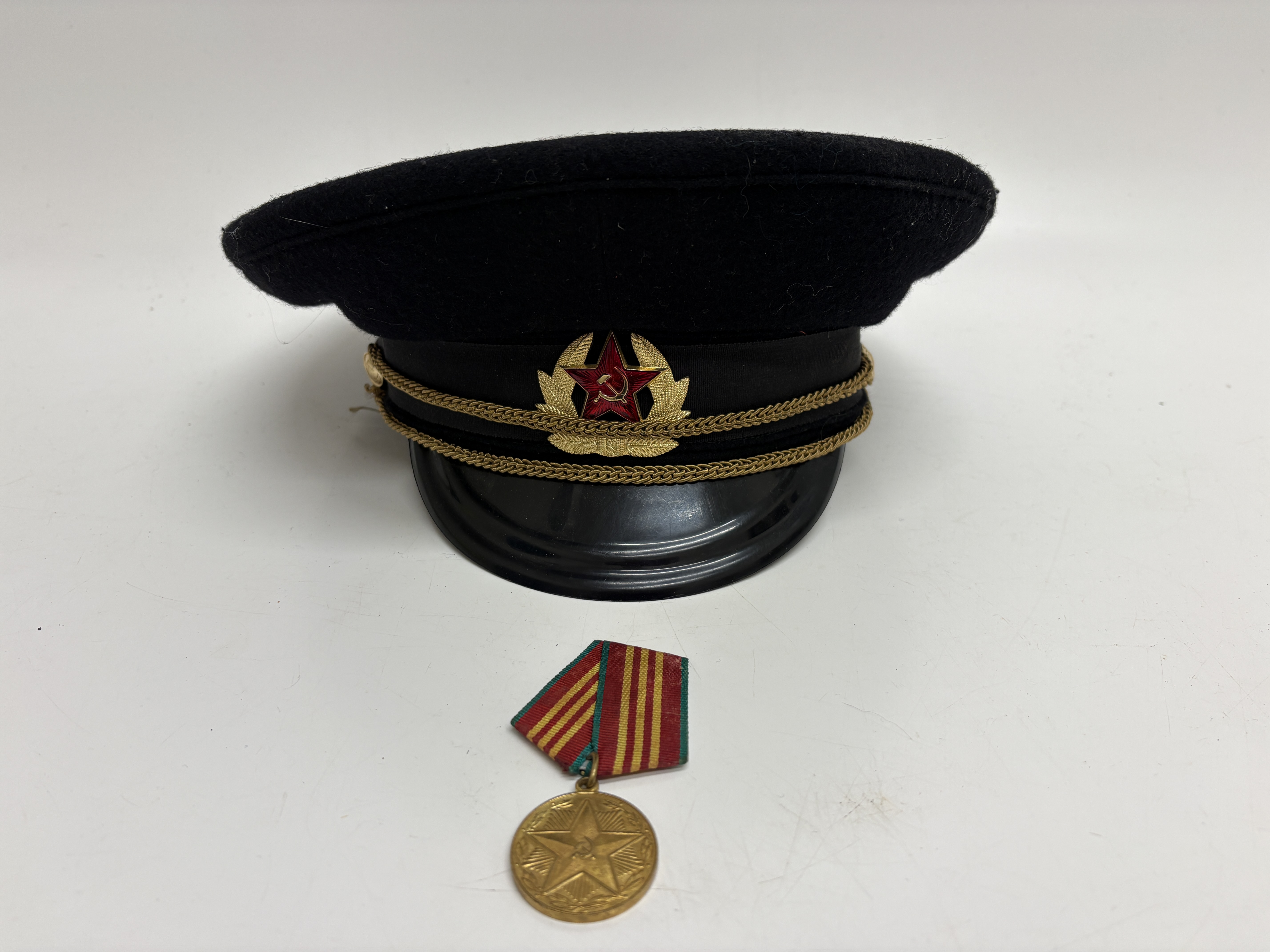 Two Soviet Union Military Items Comprising an Officer's Visor Cap and a 10-Year Service Medal