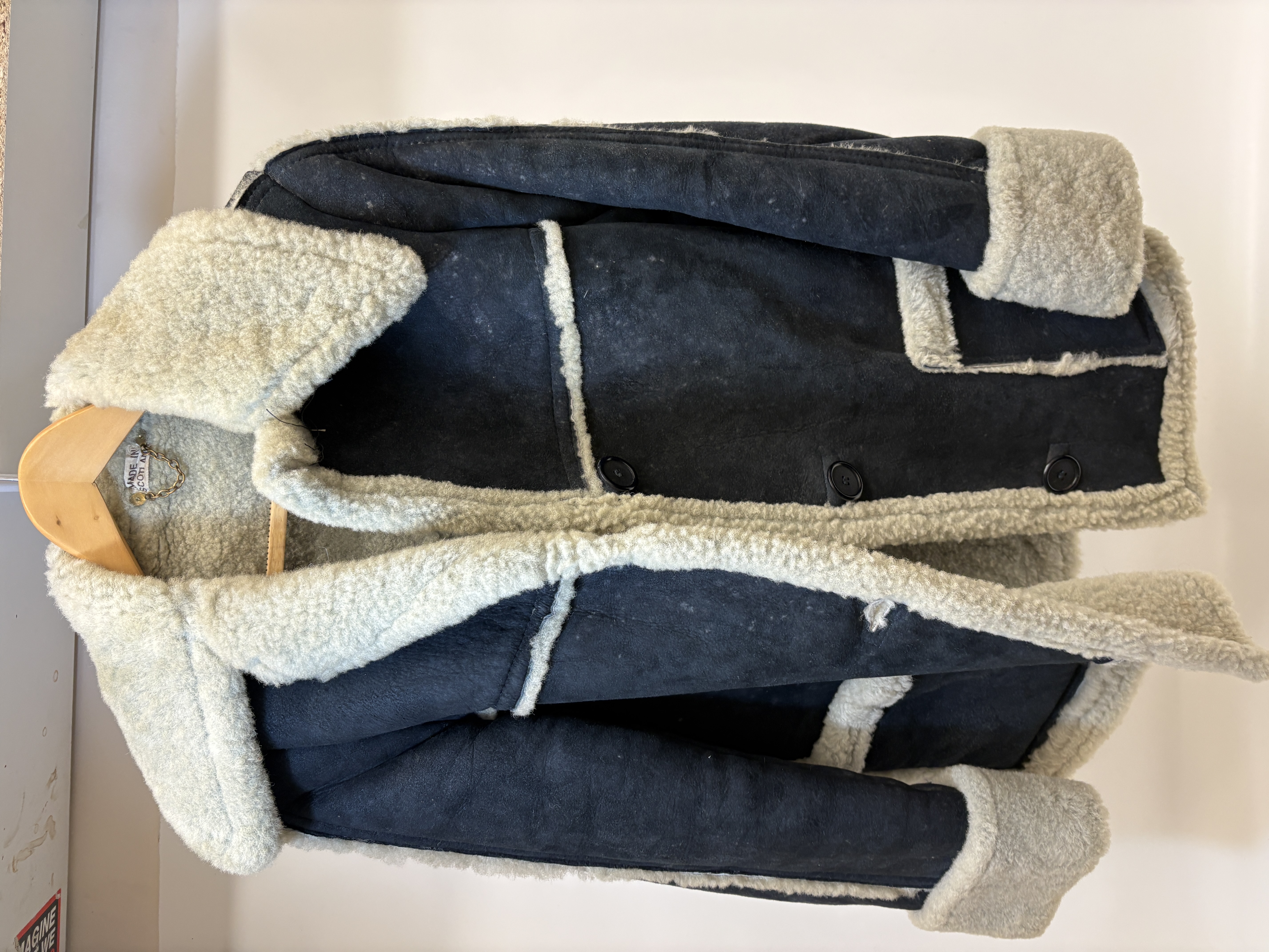 An Antartex navy blue suede and cream sheepskin car coat
