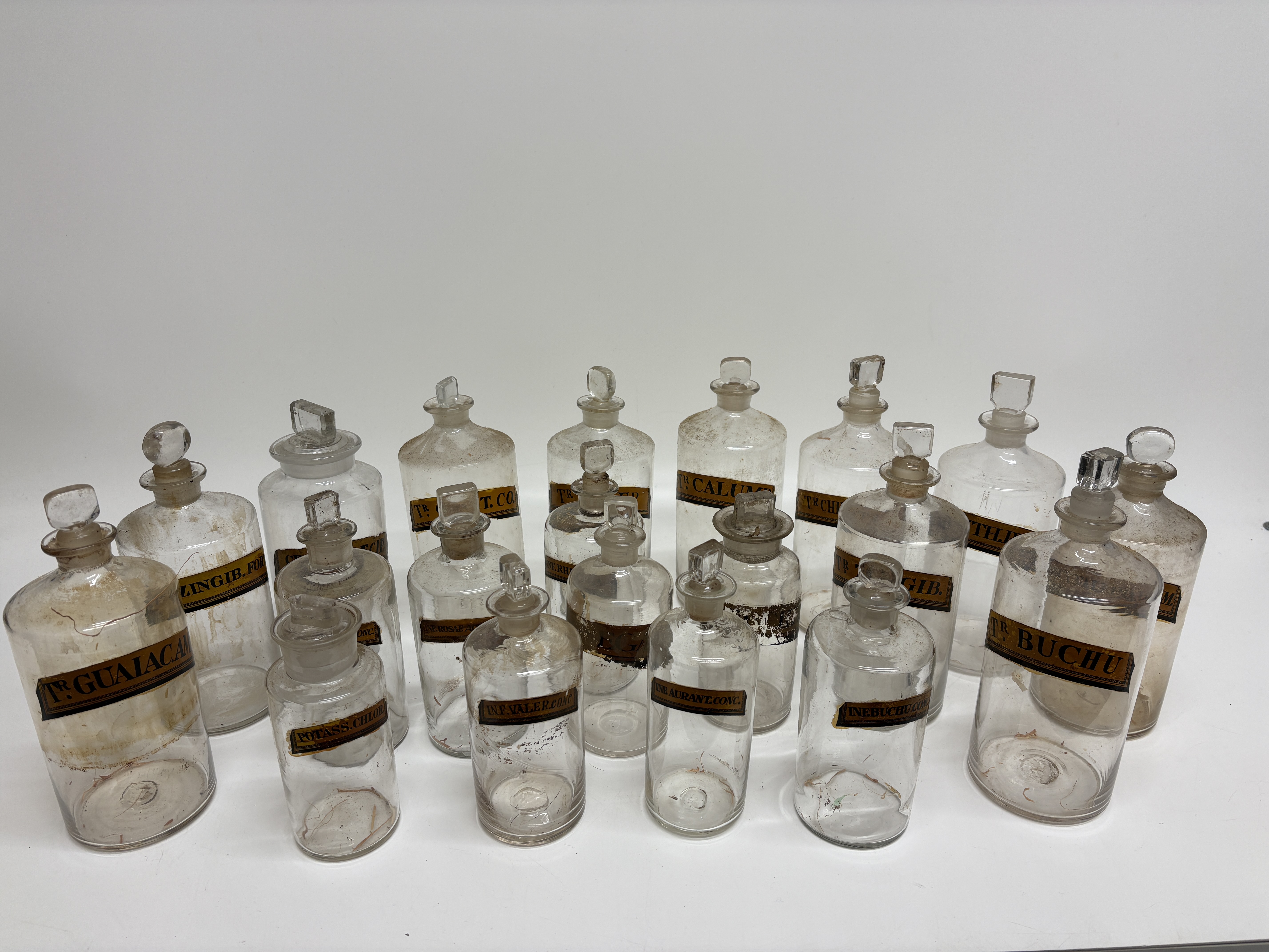 A Collection of Twenty Victorian Glass Apothecary Shop Round Bottles