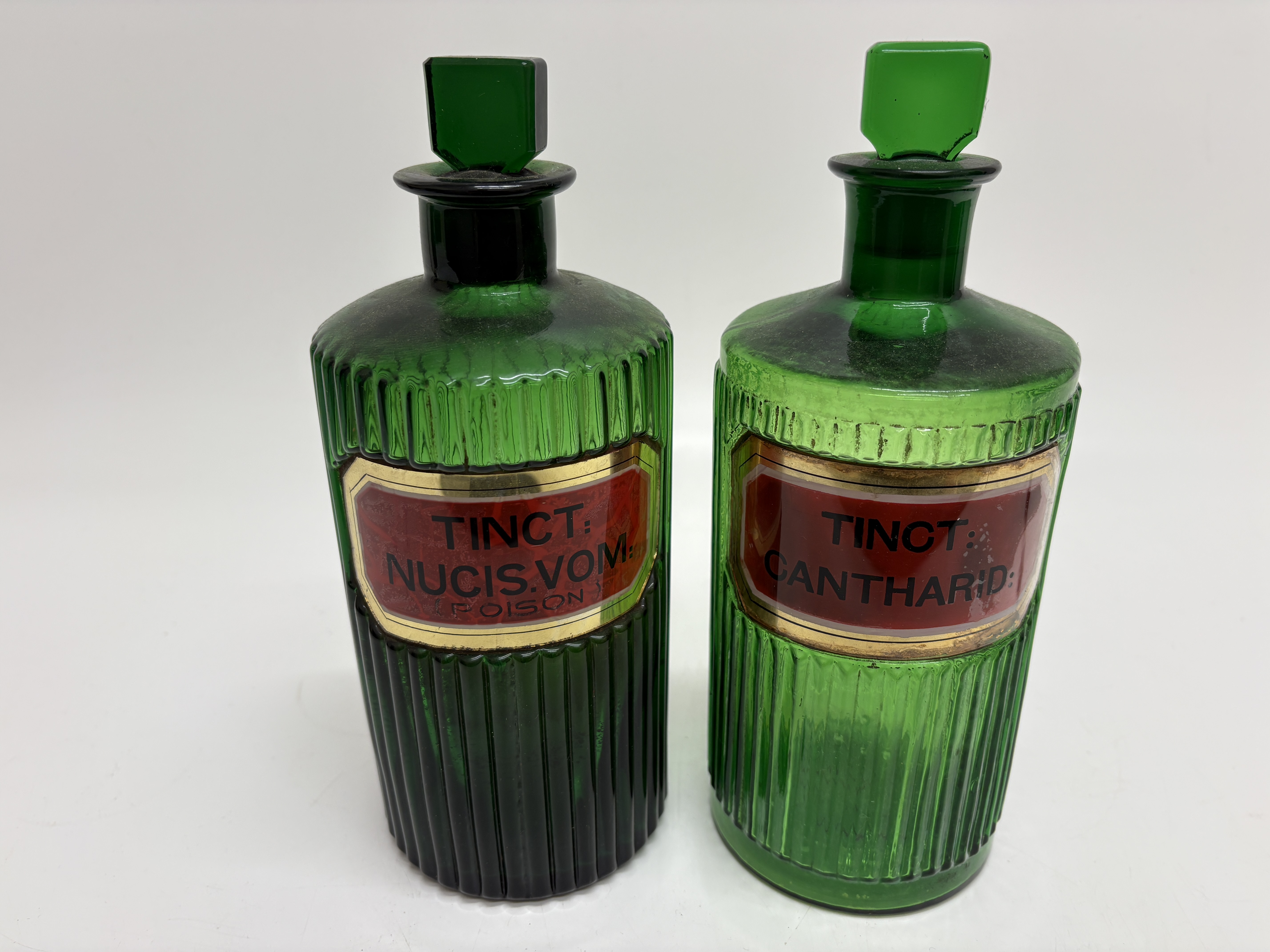A Pair of Victorian Emerald Green Ribbed Glass Apothecary Bottles