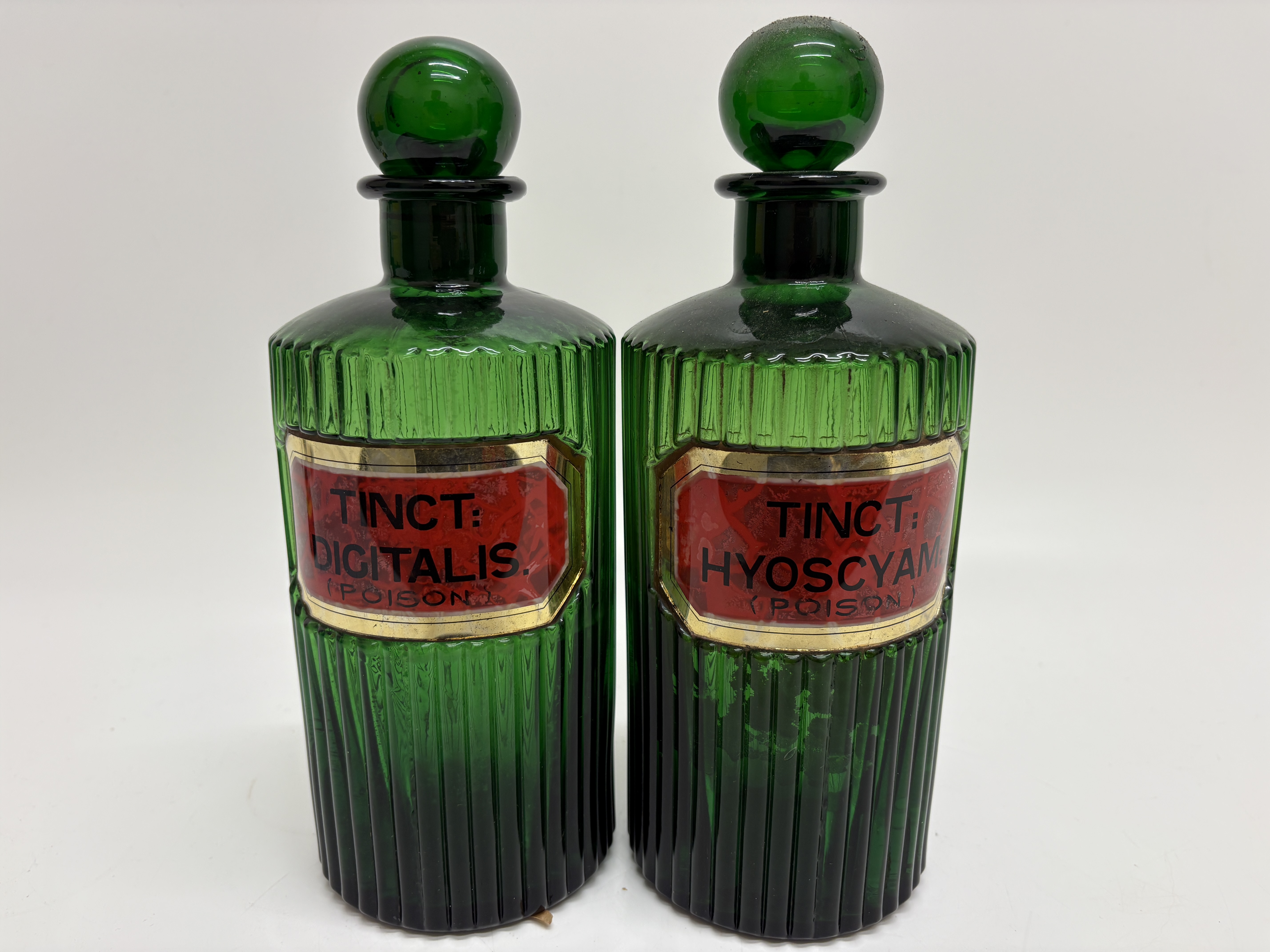 A Pair of Fluted Emerald Green Glass Apothecary Poison Bottles 25cm tall