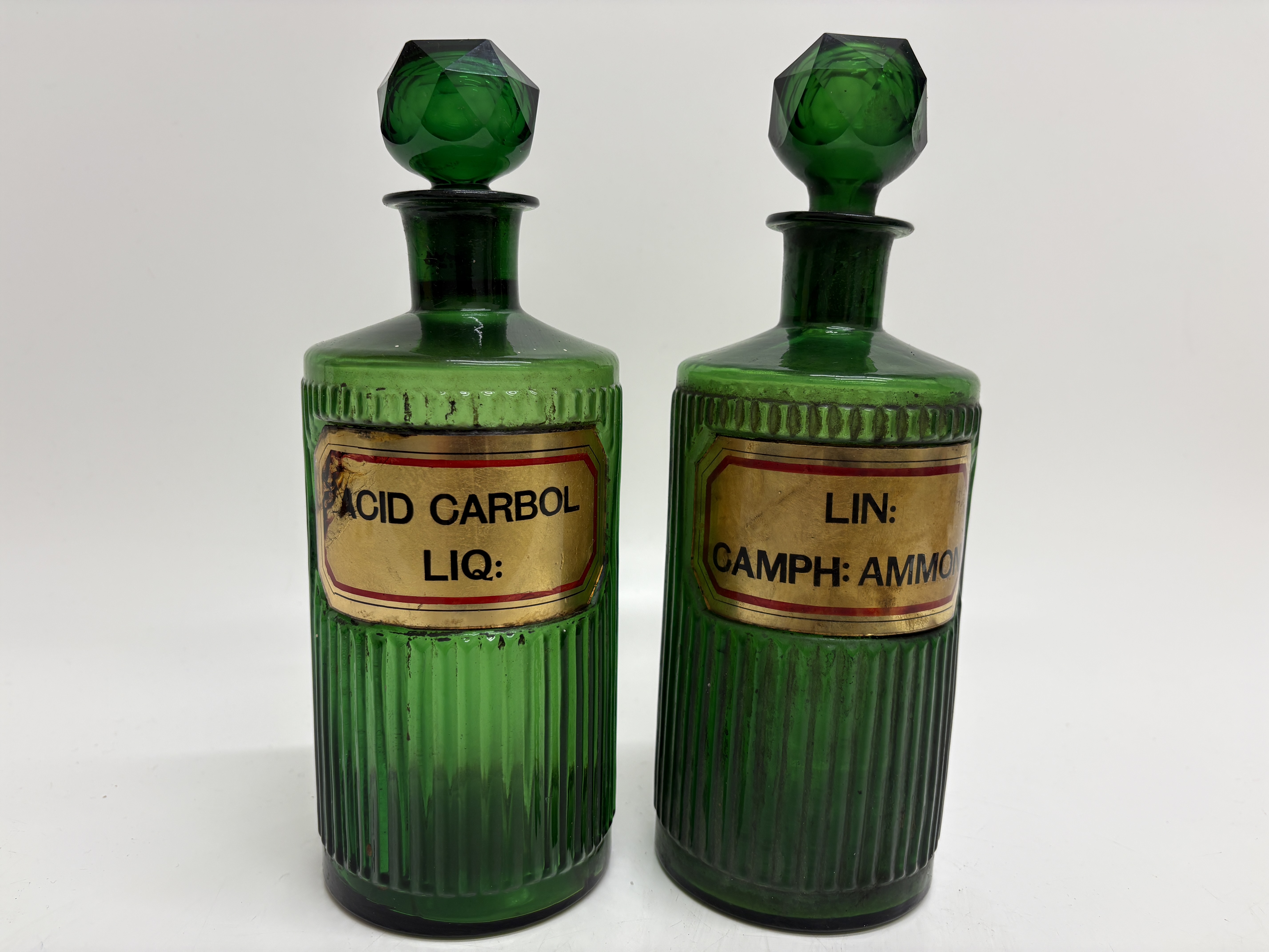 A Pair of Victorian Emerald Green Glass Apothecary Shelf Bottles 25cm tall